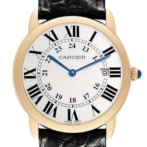 The Cartier Ronde W6700455 Men's Yellow Gold Silver Dial watch is shown from the front, highlighting its dial, Roman numerals, blue hands, and gemstone crown.