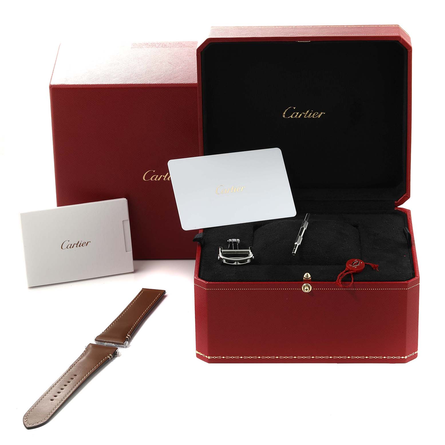 The image shows a Cartier Santos W2SA0009 Men's Steel and Gold (two tone) Silver Dial W2SA0009 Men's Steel and Gold (two tone) Silver Dial watch box, extra leather strap, buckle, and documentation from a frontal angle.