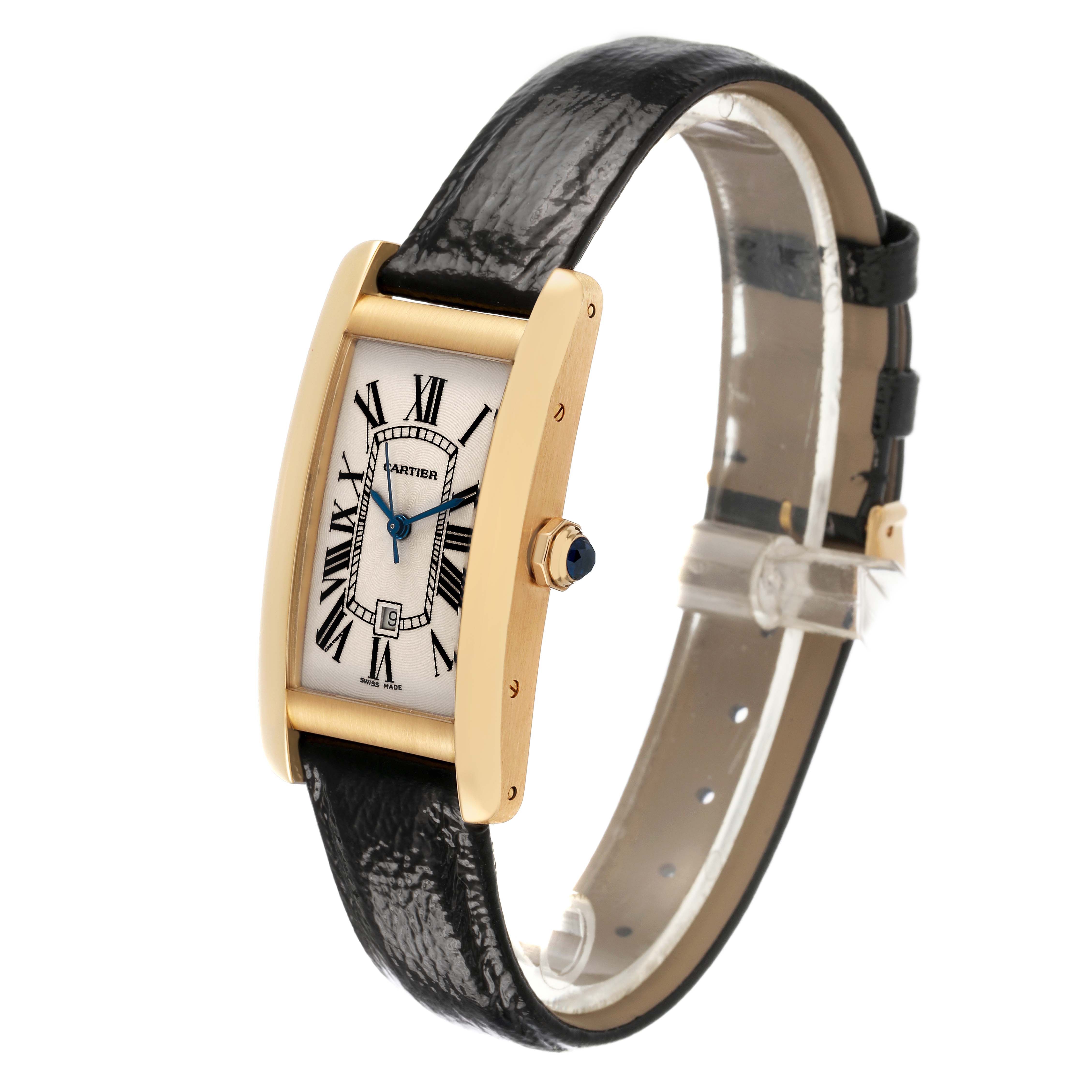 The Cartier Tank Américaine watch is shown at a slight angle highlighting its rectangular gold case, Roman numeral dial, and leather strap.