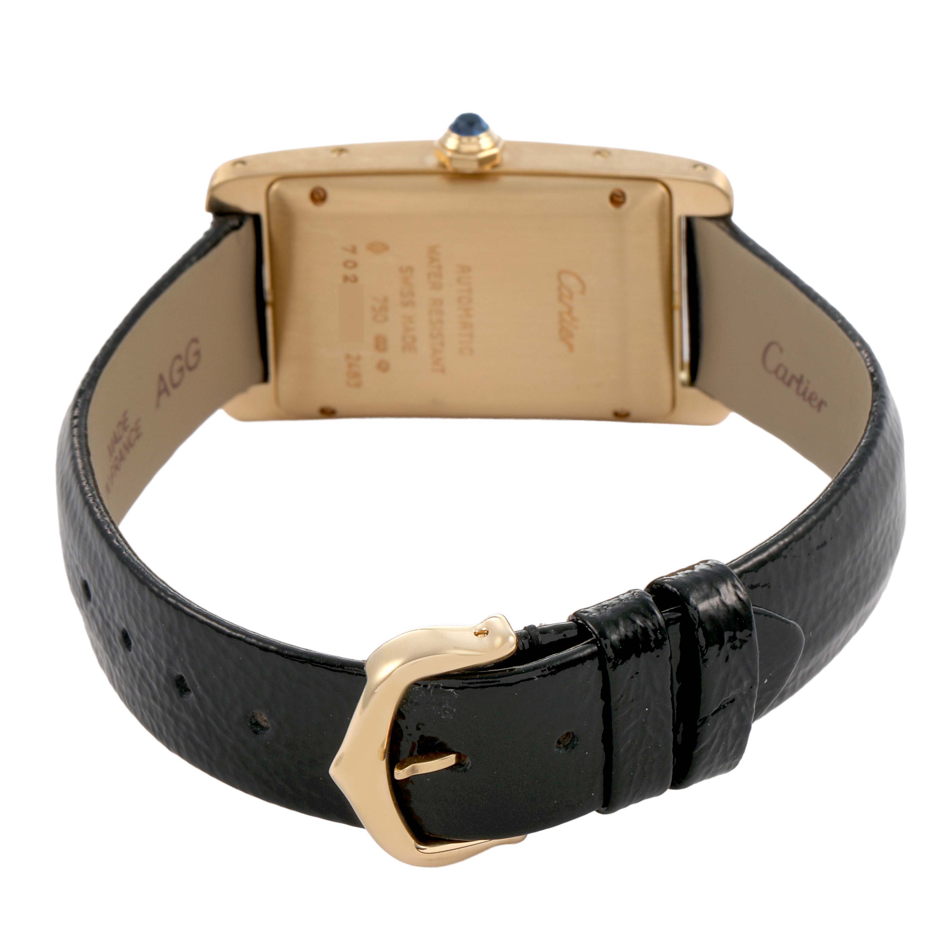 The image shows the back view of the Cartier Tank Americaine W2603556 Men's Yellow Gold Silver Dial watch, highlighting the case back and black strap with buckle.