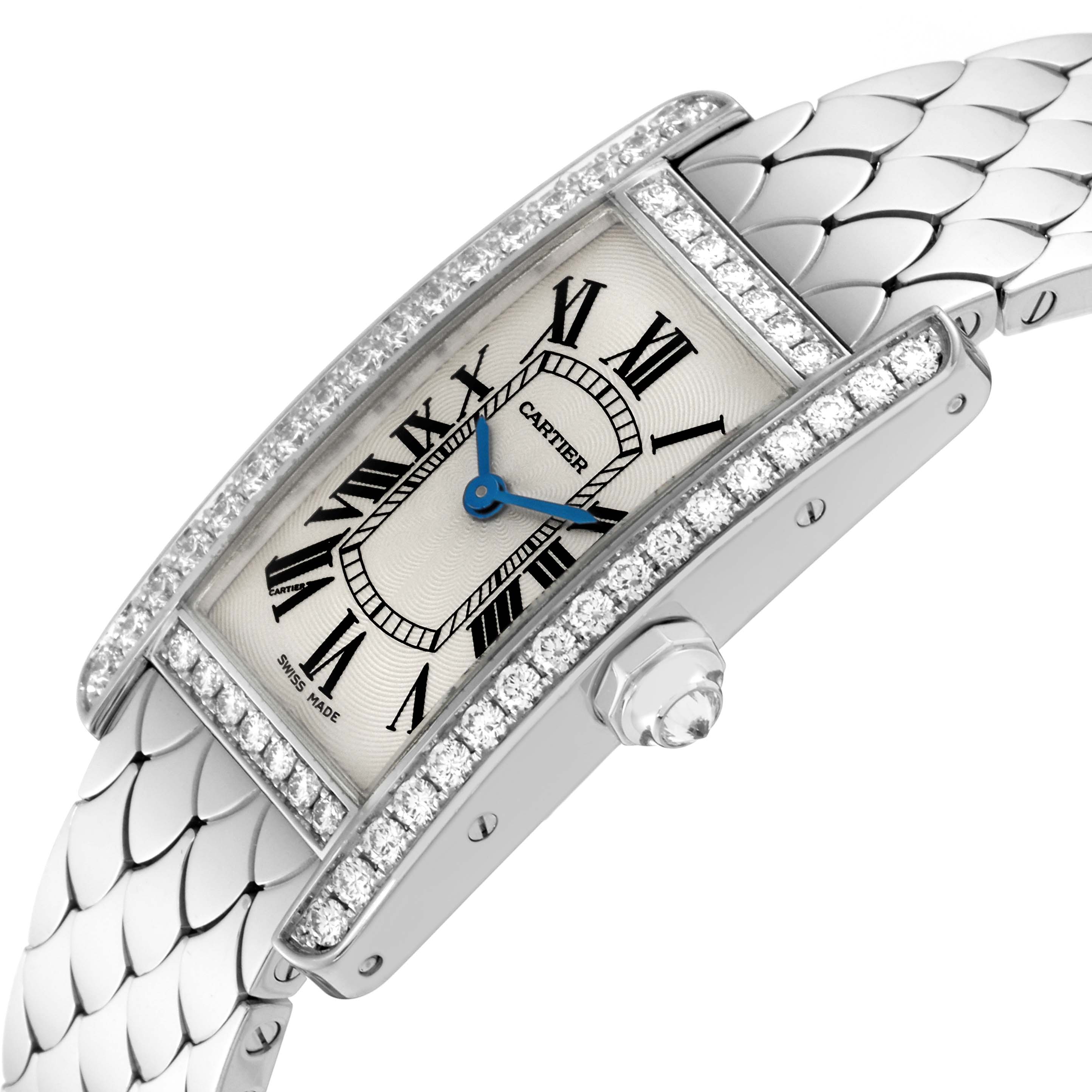 This image showcases a Cartier Tank Americaine WB710009 Women's White Gold Silver Dial WB710009 Women's White Gold Silver Dial watch at an oblique angle, highlighting the face, diamond bezel, and part of the metallic strap.