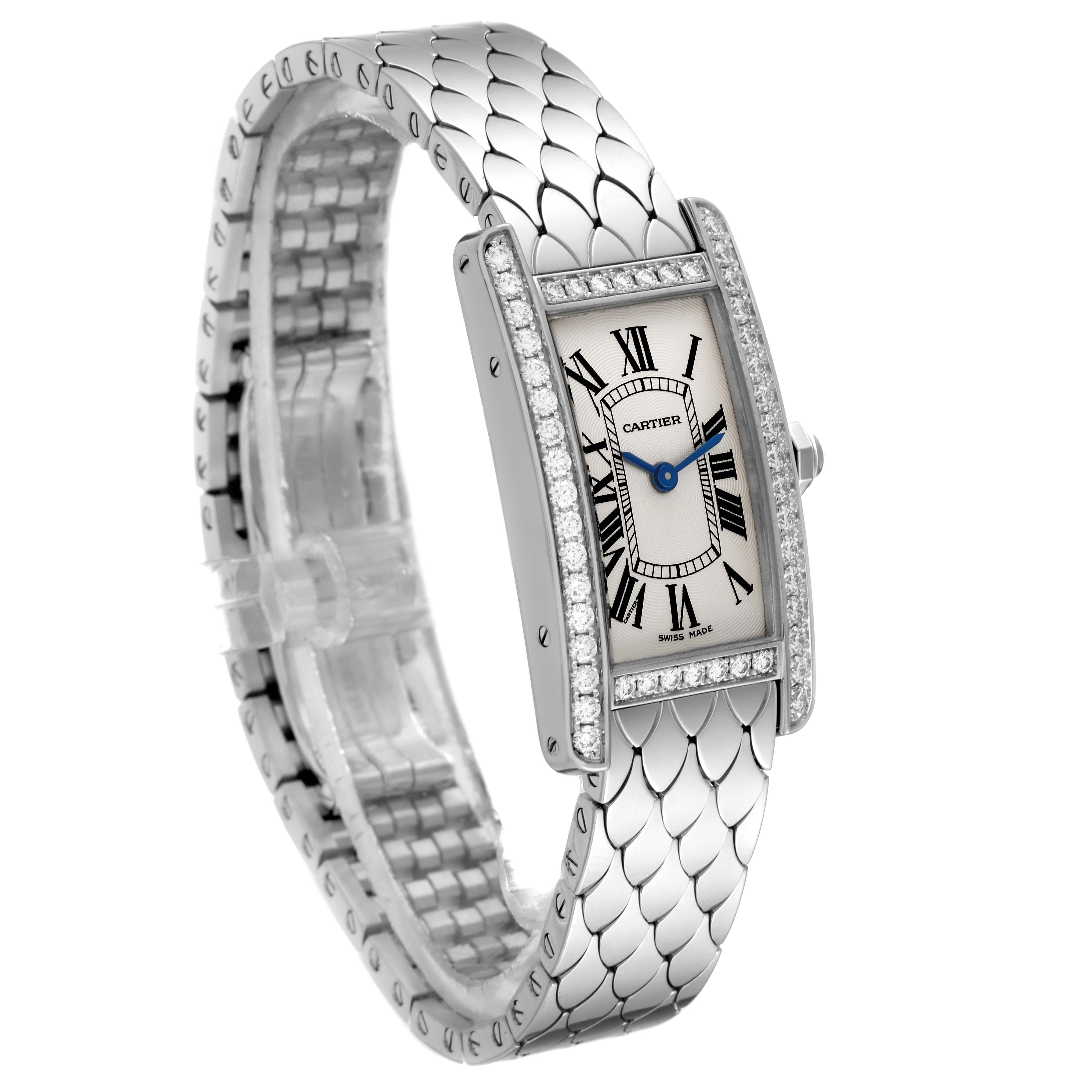 The Cartier Tank Americaine WB710009 Women's White Gold Silver Dial WB710009 Women's White Gold Silver Dial watch is shown at a three-quarter angle, displaying its face, side, and detailed metal strap adorned with diamonds.