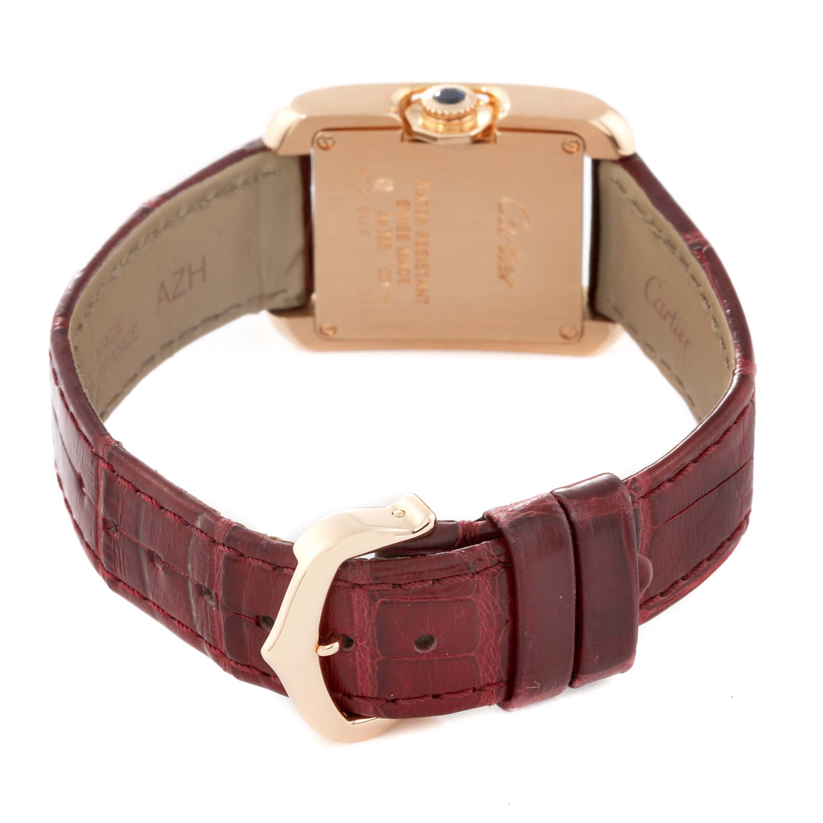 This image shows the back case and red leather strap of a Cartier Tank Anglaise WJTA0007 Women's Rose Gold Silver Dial WJTA0007 Women's Rose Gold Silver Dial watch, highlighting the deployment clasp and caseback inscriptions.