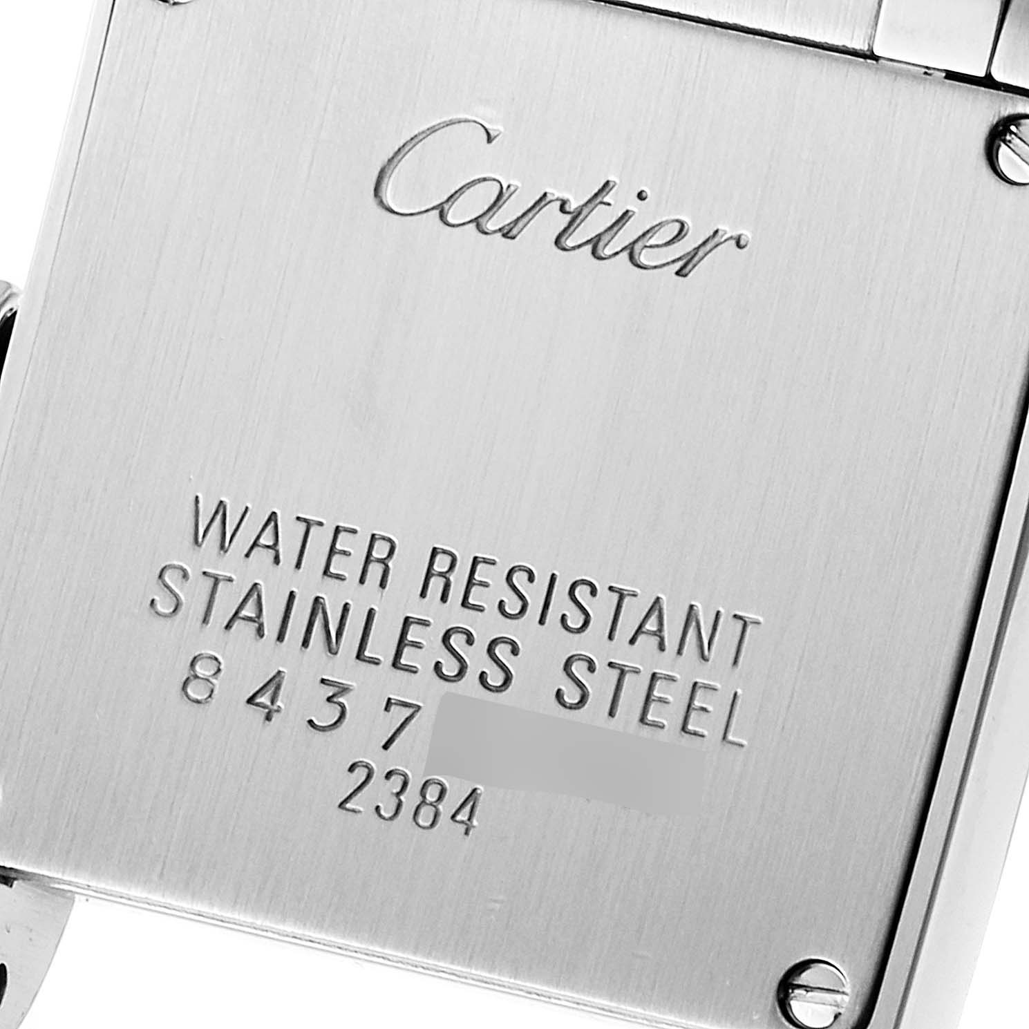 This is a close-up of the back case of the Cartier Tank Francaise W51028Q3 Women
s Stainless Steel Mother of Pearl Dial W51028Q3 Women
s Stainless Steel Mother of Pearl Dial watch, showing its engravings.