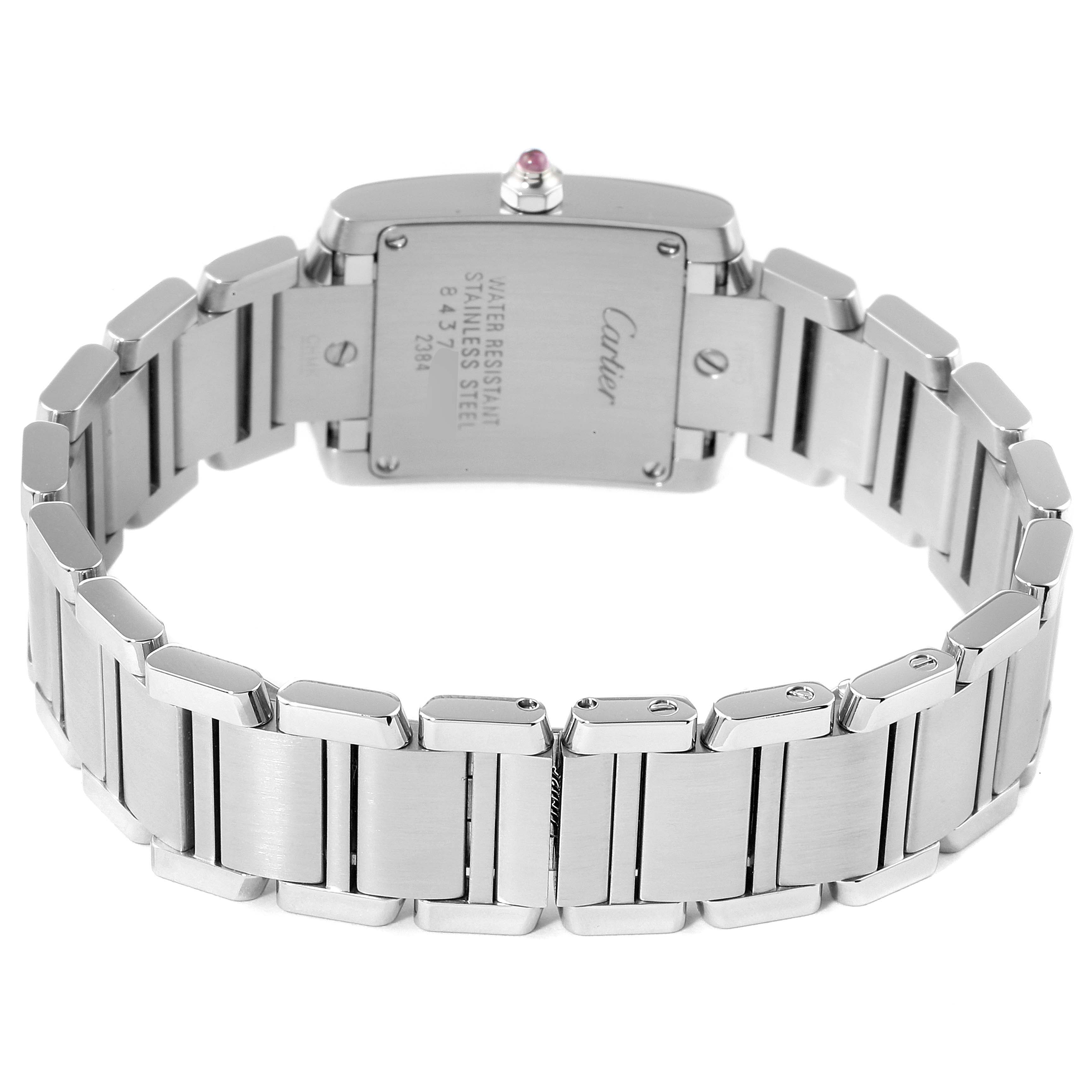 This image shows the back view of a Tank Francaise watch by Cartier, highlighting its stainless steel bracelet and case back.