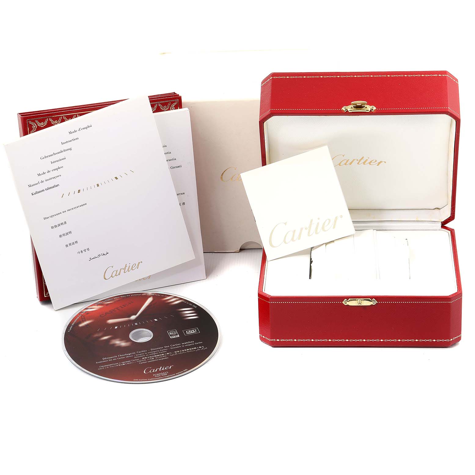 The image shows accessories for the Cartier Tank Francaise W51028Q3 Women
s Stainless Steel Mother of Pearl Dial W51028Q3 Women
s Stainless Steel Mother of Pearl Dial watch, including a red case, a white card, manuals, and a CD.