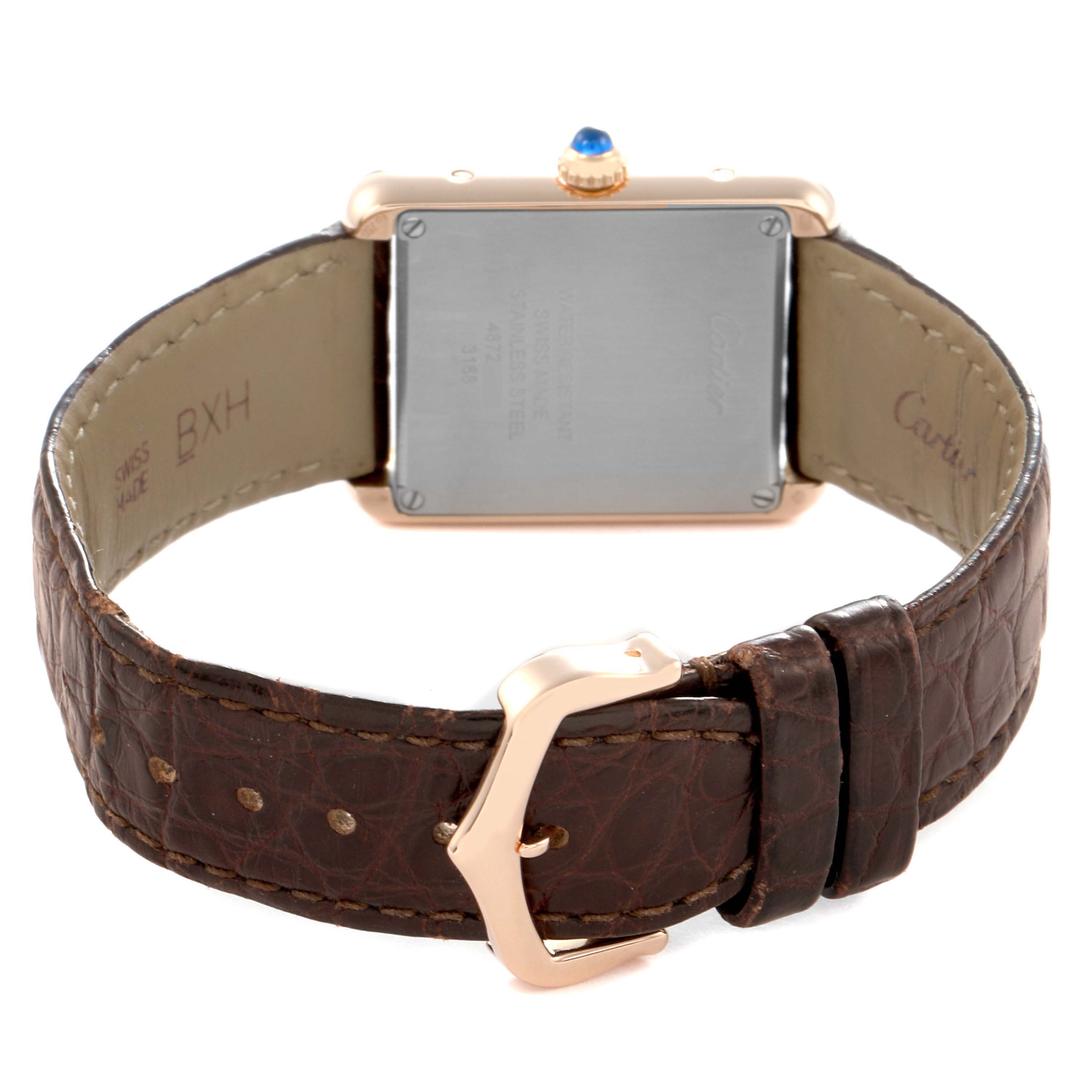 The Cartier Tank Solo W5200002 Women
s Steel and Gold (two tone) Silver Dial watch is shown from the back, highlighting the stainless steel case back, crown, and leather strap with buckle.