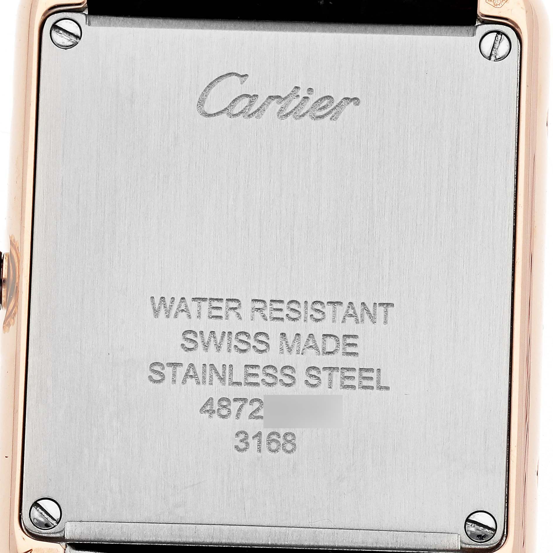 The image shows the back plate of a Cartier Tank Solo W5200002 Women
s Steel and Gold (two tone) Silver Dial watch, featuring branding and specifications.