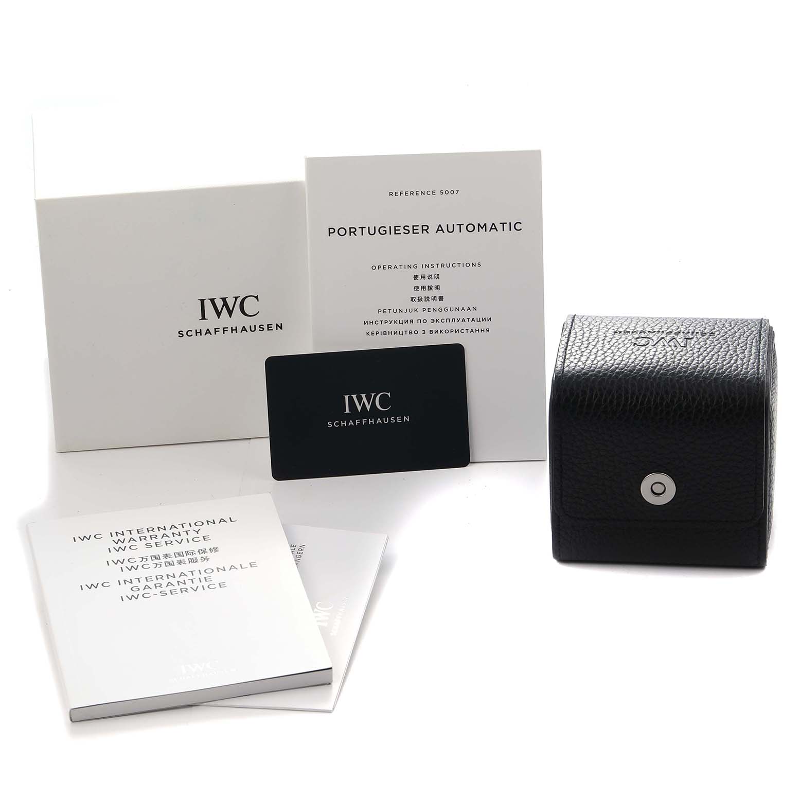 The image shows IWC Portuguese IW500712 Men
s Stainless Steel Silver Dial model accessories, including manuals, a warranty card, and a watch box.