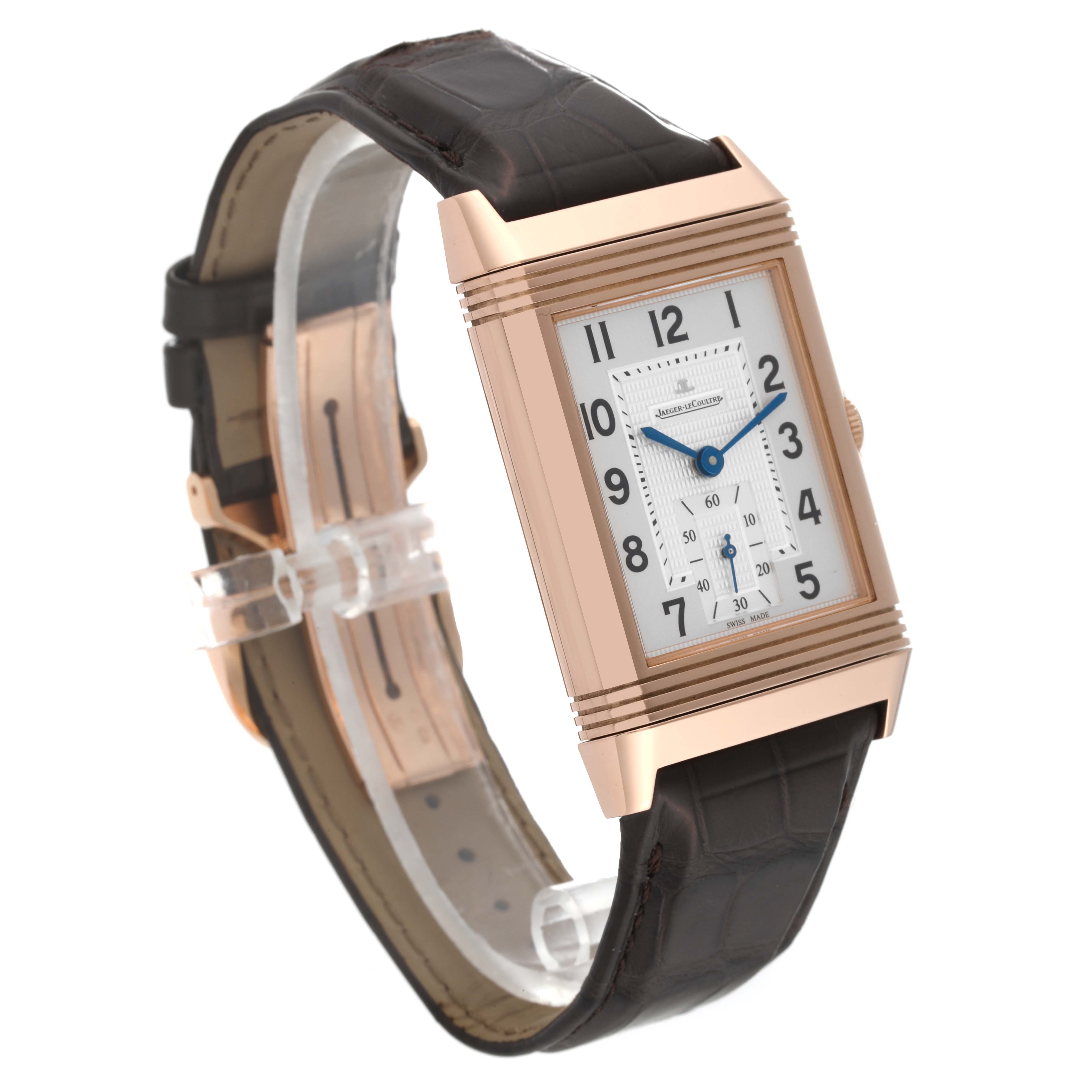 The image shows a Jaeger-LeCoultre Reverso watch at a slight side angle, displaying its rectangular face and leather strap.