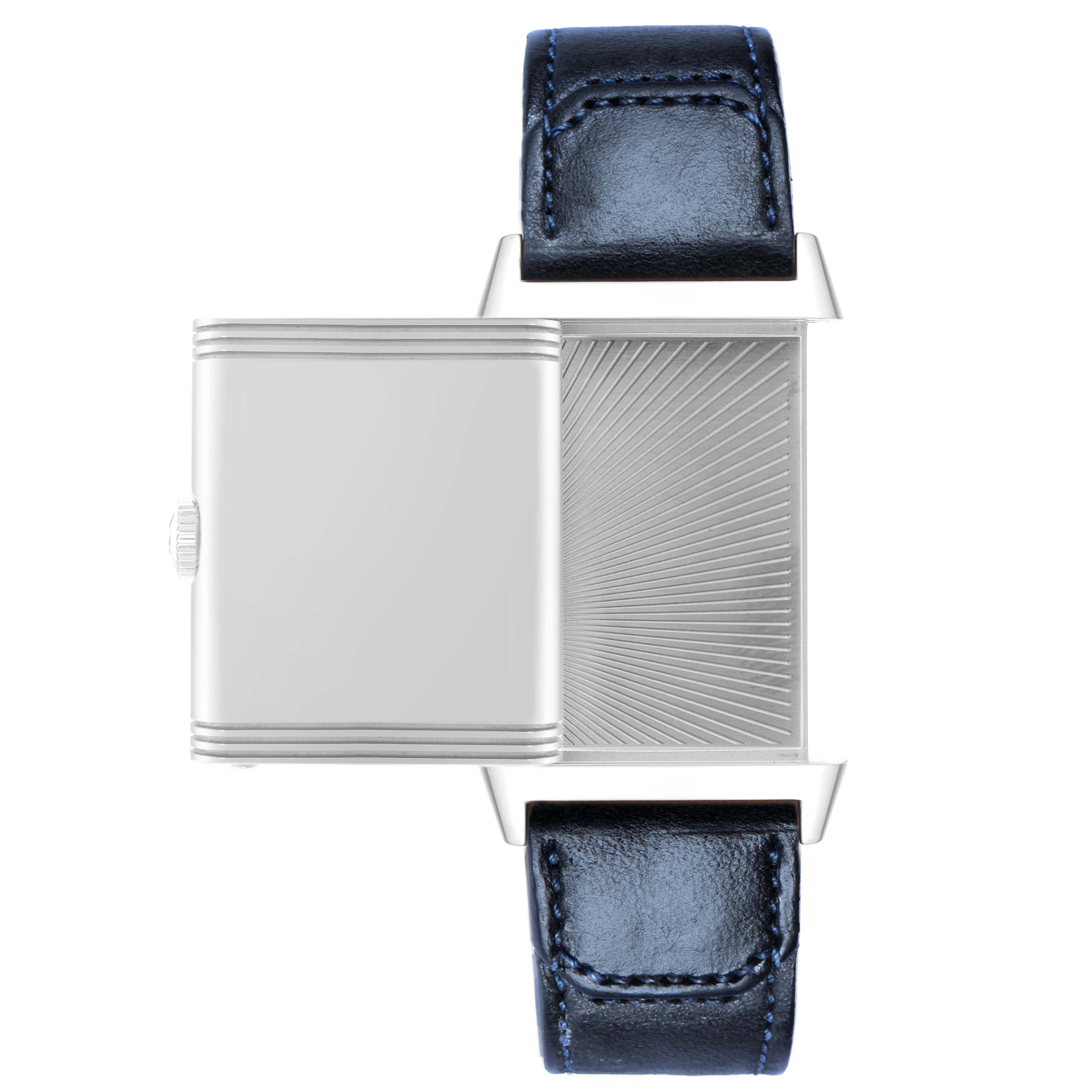 The image shows a Jaeger LeCoultre Reverso 214.8.62 Q3978480 Men
s Stainless Steel Blue Dial watch with its case partially rotated, highlighting the back detail and blue leather strap.