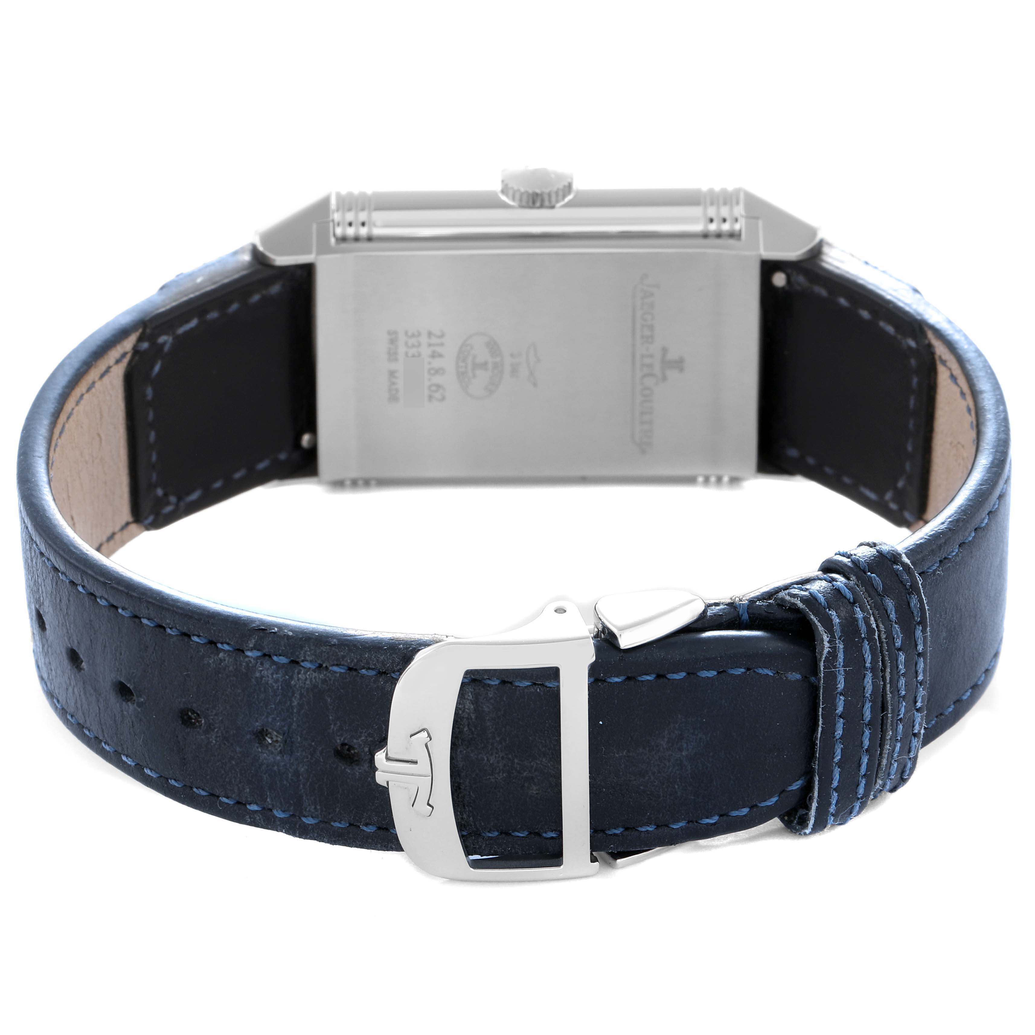 The image shows the back of a Jaeger LeCoultre Reverso 214.8.62 Q3978480 Men
s Stainless Steel Blue Dial watch with its blue leather strap and clasp visible.