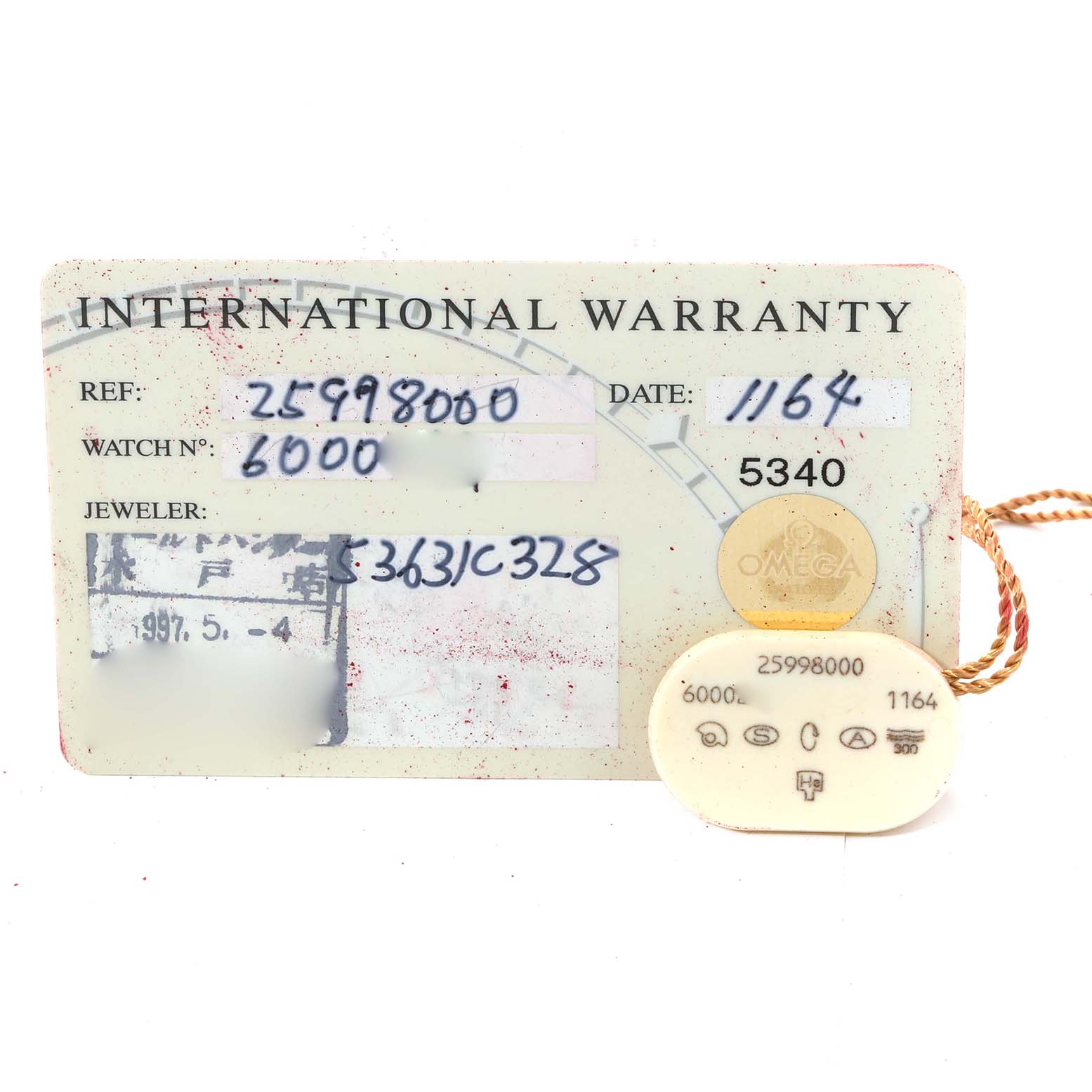 The image shows an International Warranty card and tag for the Omega Seamaster 2599.80.00 Men
s Stainless Steel Blue Dial 2599.80.00 Men
s Stainless Steel Blue Dial model.