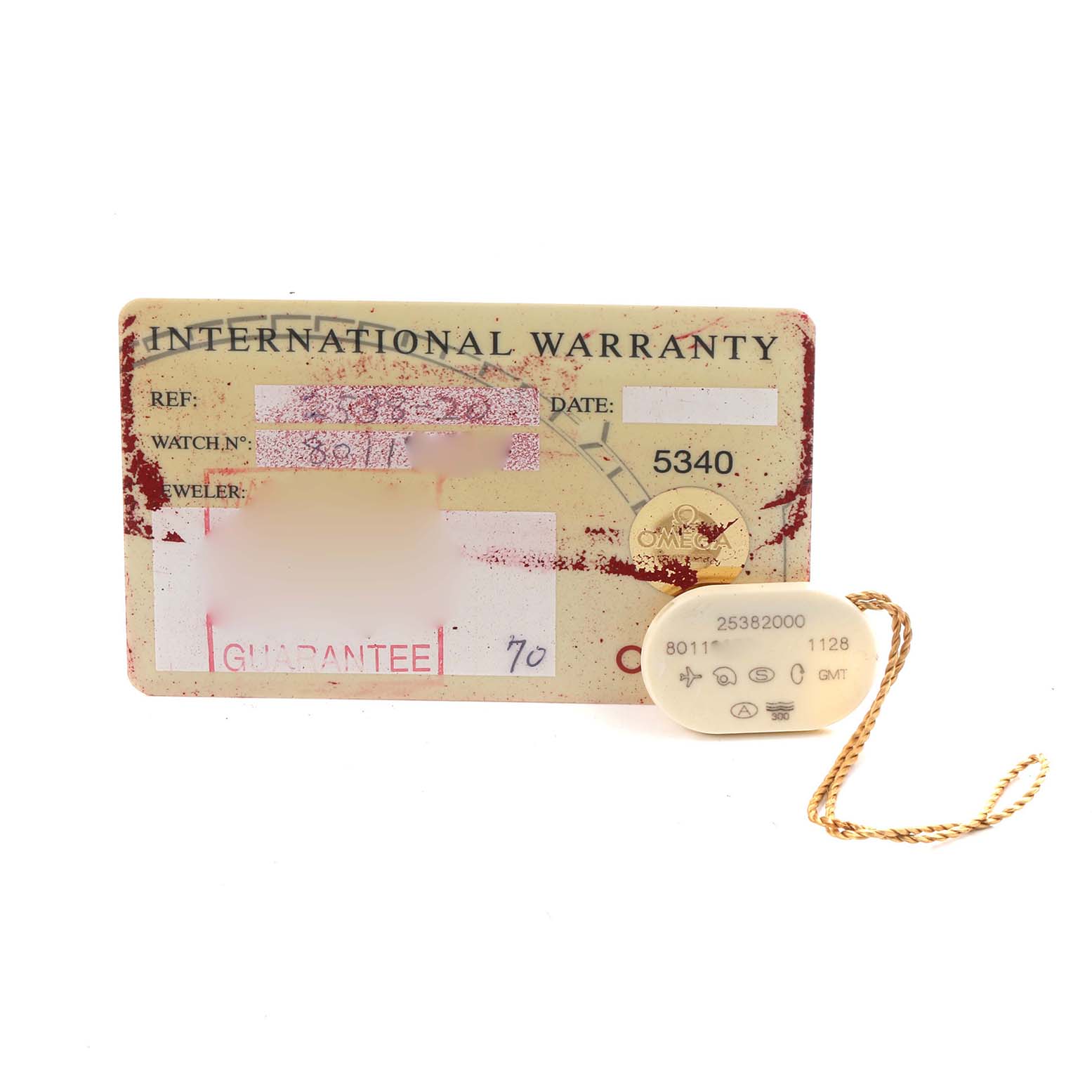 The image shows an Omega Seamaster 2538.20.00 Men
s Stainless Steel White Dial International Warranty card and a tag with reference and watch numbers.