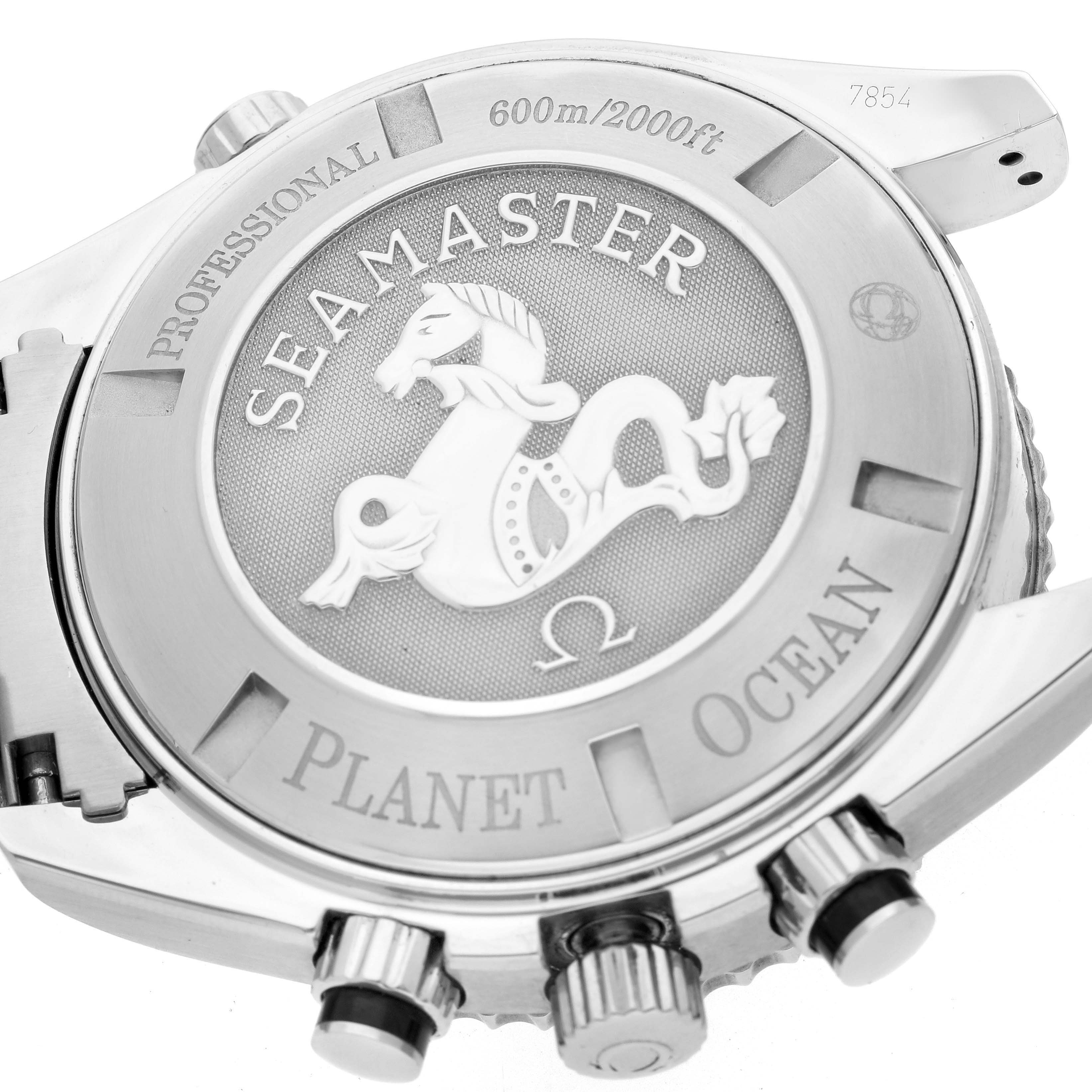 The image shows the back case of the Omega Planet Ocean 2210.50.00 Men
s Stainless Steel Black Dial 2210.50.00 Men
s Stainless Steel Black Dial watch, including its engravings and crown.