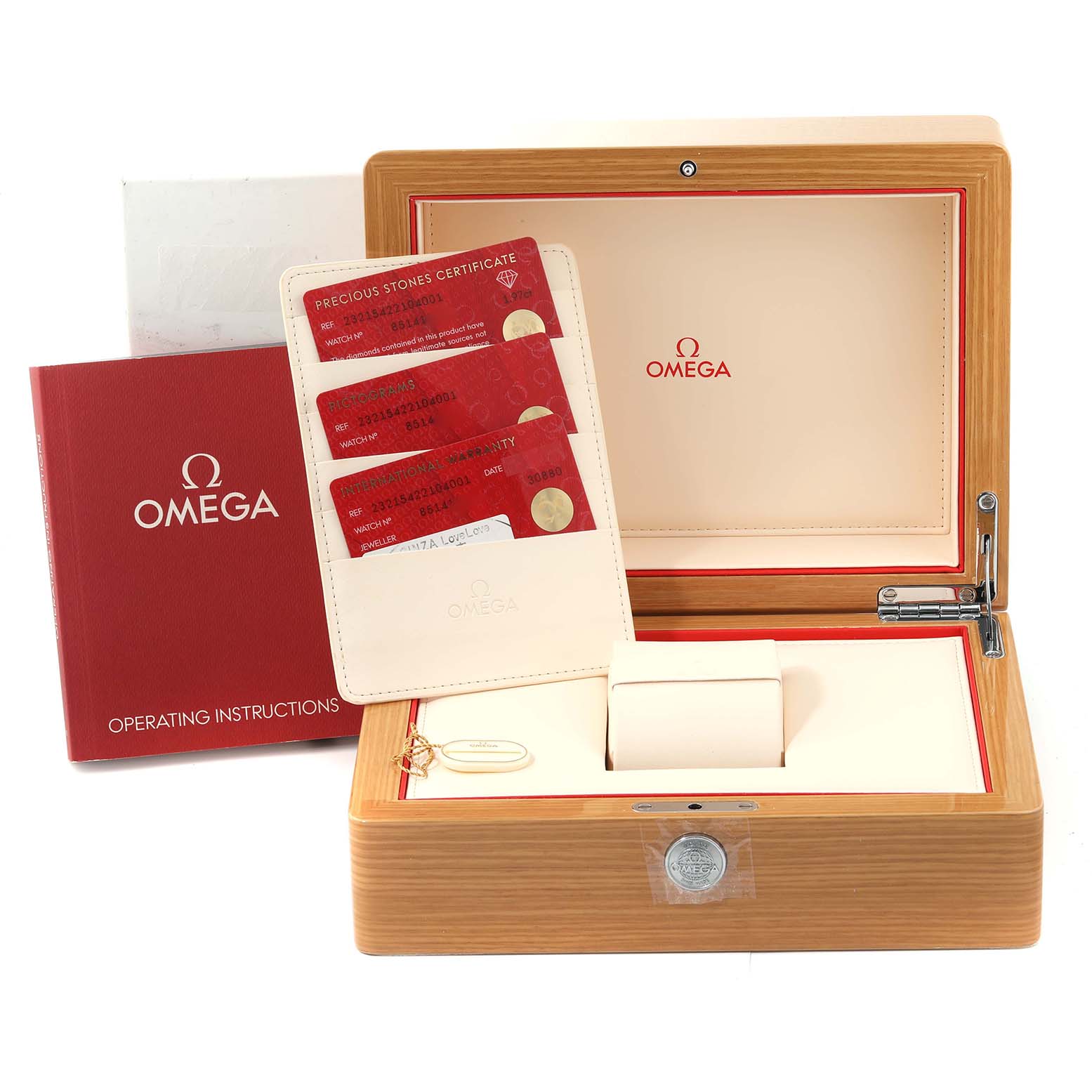 This image shows the packaging for an Omega Planet Ocean 232.15.42.21.04.001 Men's Stainless Steel White Dial 232.15.42.21.04.001 Men's Stainless Steel White Dial watch, including the box, operating instructions, and certification cards.