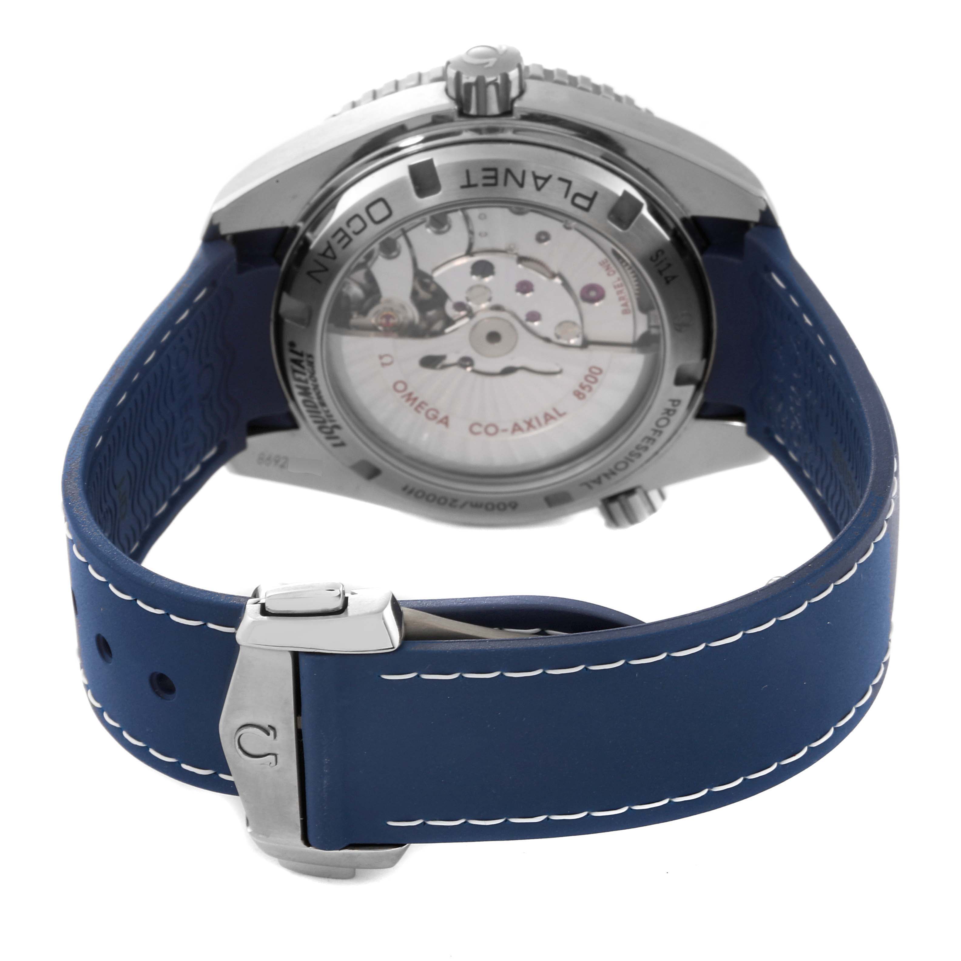 The image shows the back view of an Omega Planet Ocean 232.92.42.21.03.001 Men
s Titanium Blue Dial 232.92.42.21.03.001 Men
s Titanium Blue Dial model watch, featuring its open case back and blue strap.