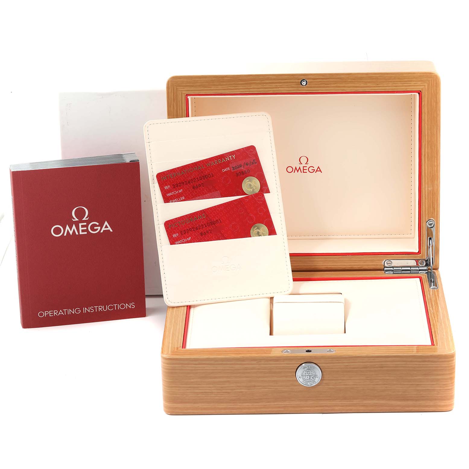 The image shows a wooden Omega Planet Ocean 232.92.42.21.03.001 Men
s Titanium Blue Dial 232.92.42.21.03.001 Men
s Titanium Blue Dial watch box, warranty cards, and an operating instructions booklet.