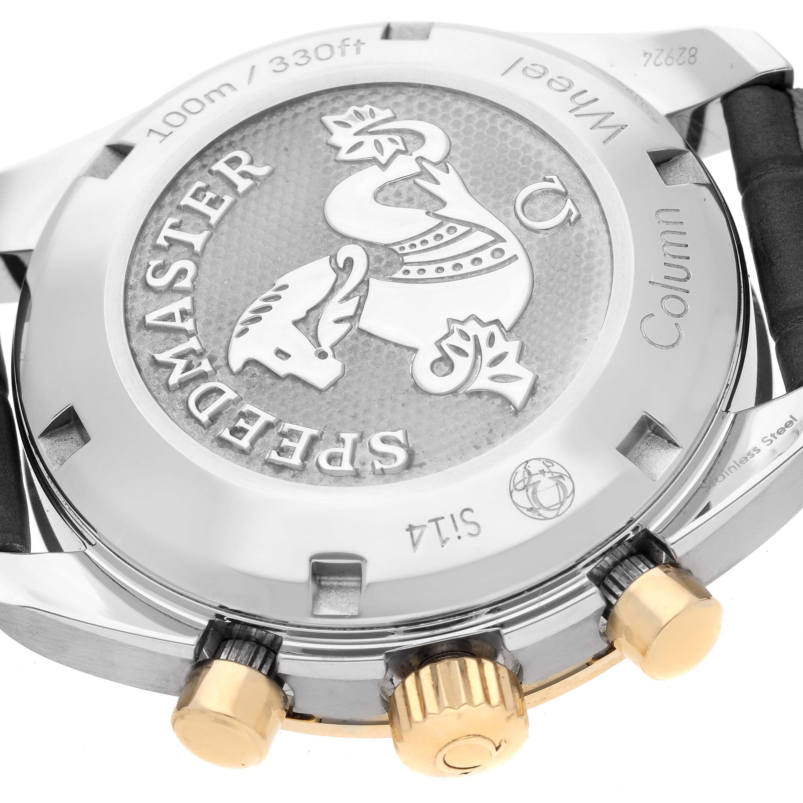 The image shows the back case of an Omega Speedmaster 324.23.38.50.02.001 Men's Steel and Gold (two tone) Silver Dial 324.23.38.50.02.001 Men's Steel and Gold (two tone) Silver Dial watch, featuring its engraved design and part of the crown and pushers.