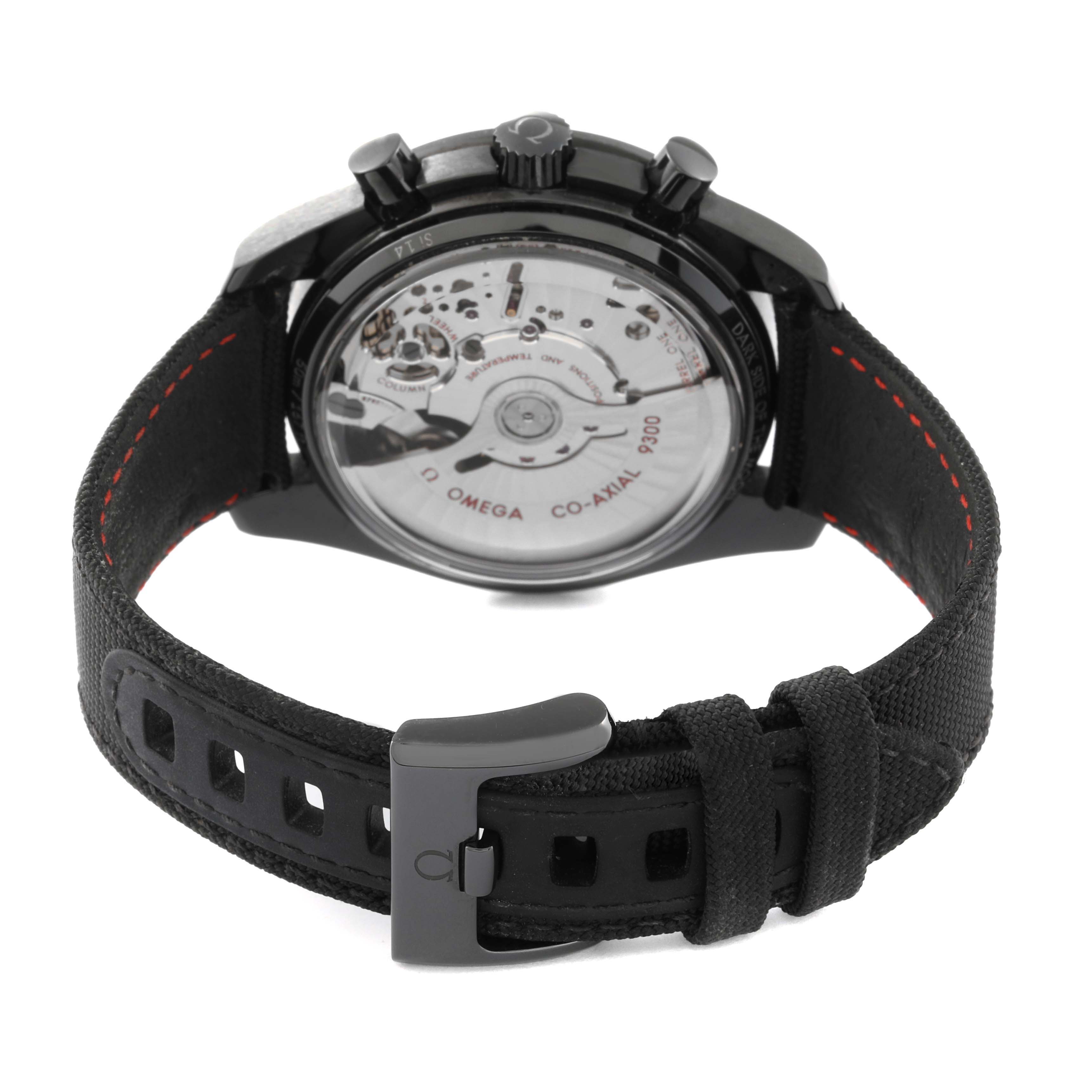 The image shows the back view of an Omega Speedmaster 311.92.44.51.01.003 Men's Ceramic Black Dial 311.92.44.51.01.003 Men's Ceramic Black Dial watch, highlighting the movement and the black strap with a clasp.