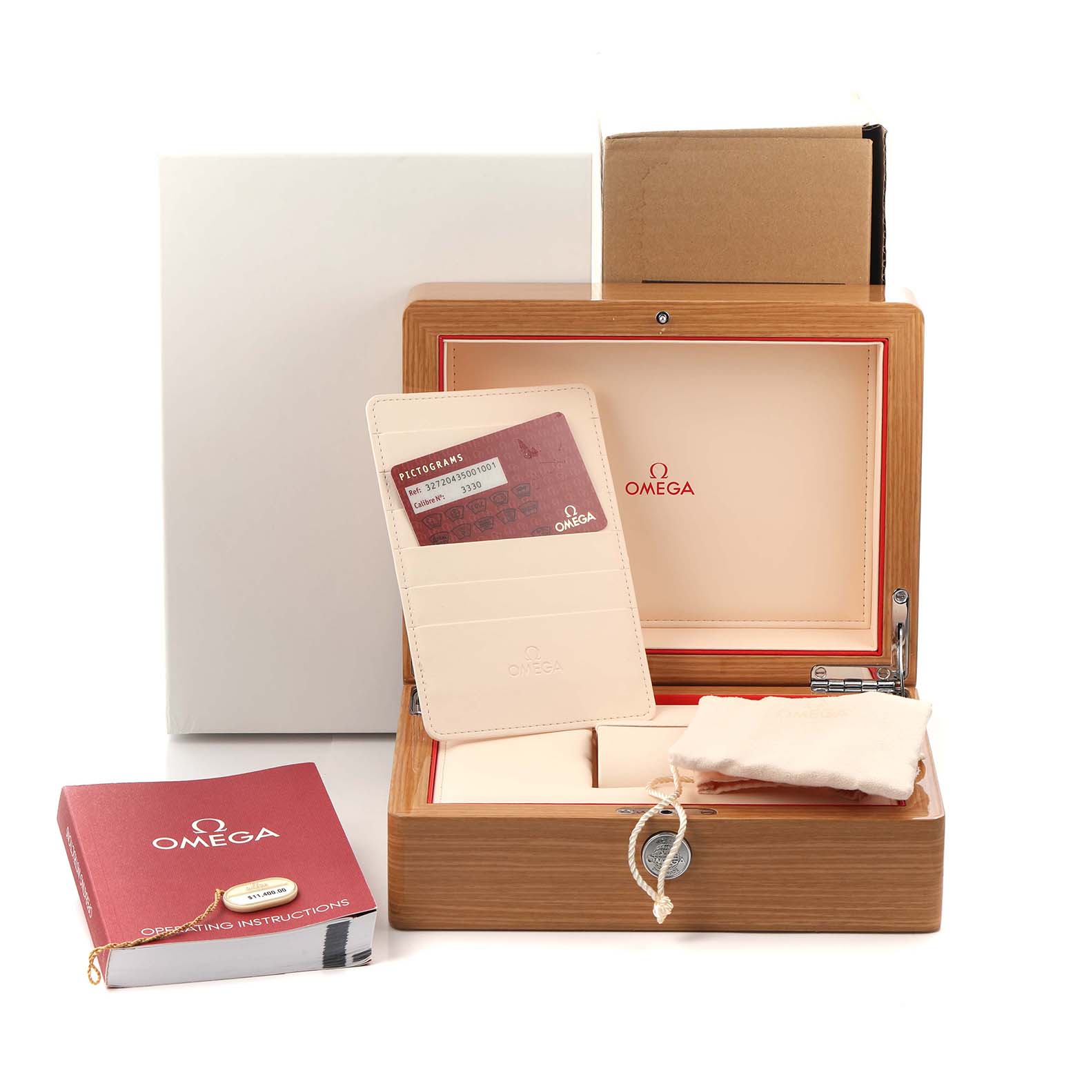 The image shows an Omega Speedmaster 327.20.43.50.01.001 Men
s Steel and Gold (two tone) Grey Dial watch box with accessories, including the manual, cardholder with cards, and a pouch.