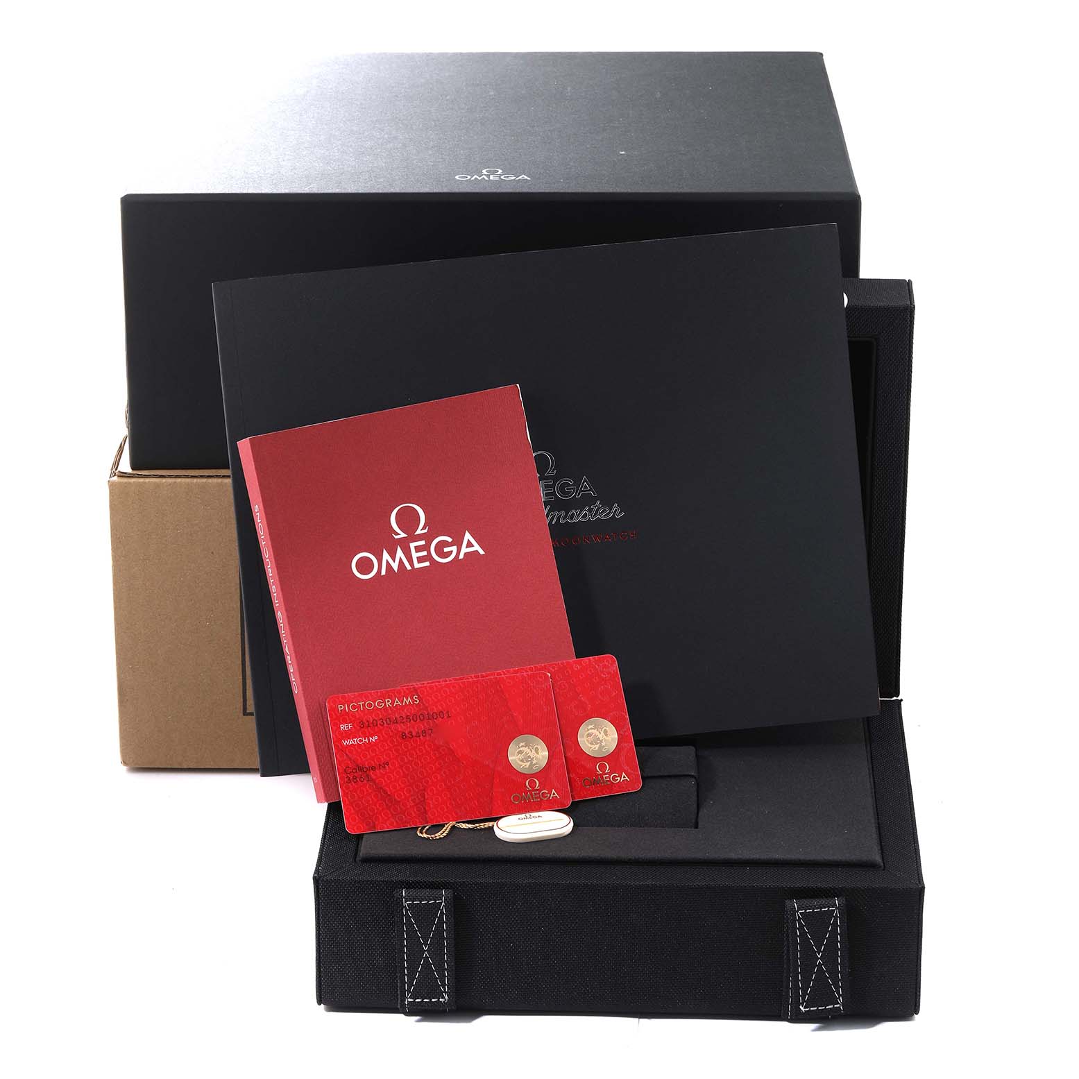 The image shows the package contents of an Omega Speedmaster 310.30.42.50.01.001 Men
s Stainless Steel Black Dial 310.30.42.50.01.001 Men
s Stainless Steel Black Dial, including boxes, a red booklet, and warranty cards.
