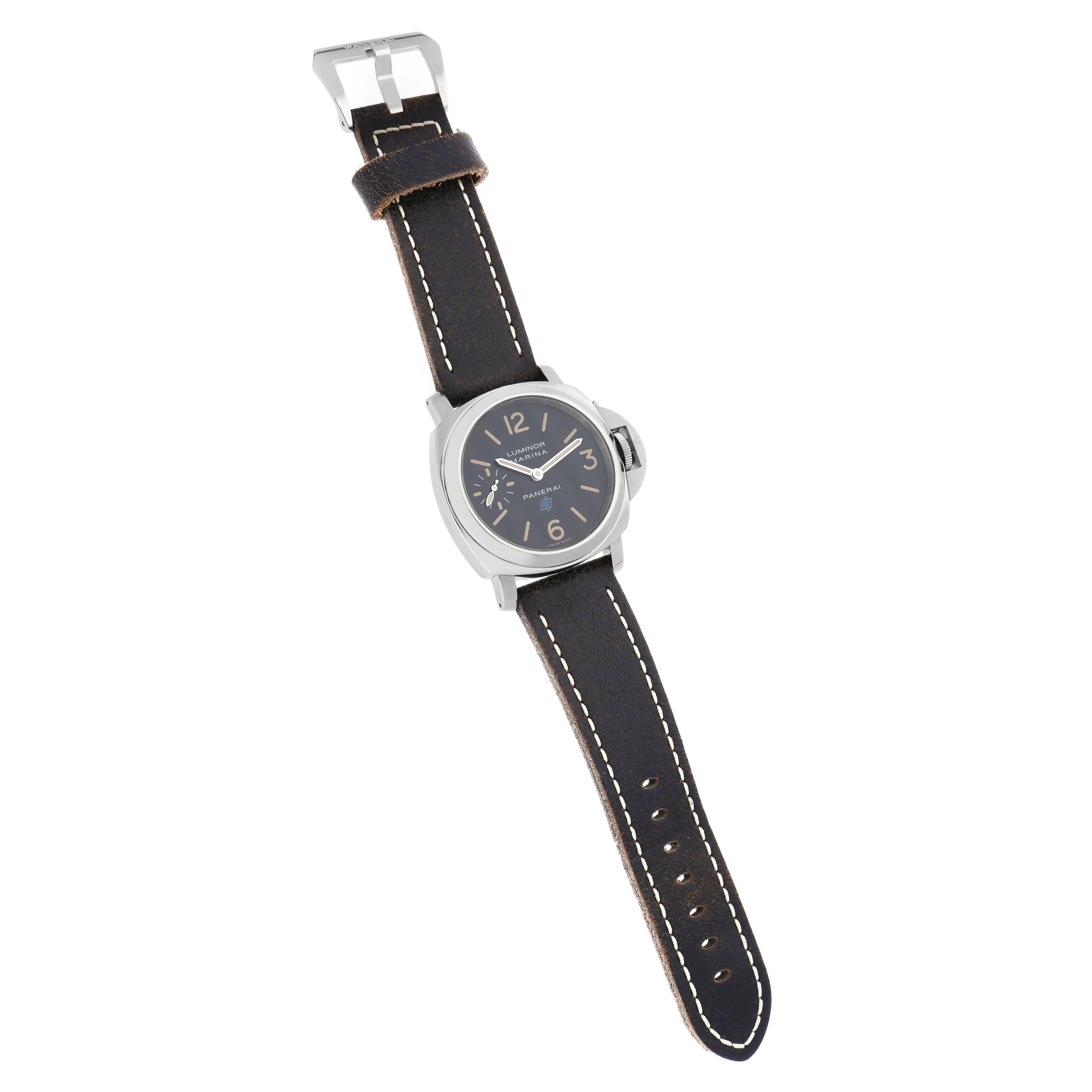 The Panerai Luminor PAM00631 Men
s Stainless Steel Black Dial watch is shown from a top-down angle, highlighting the face, case, crown, and leather strap.