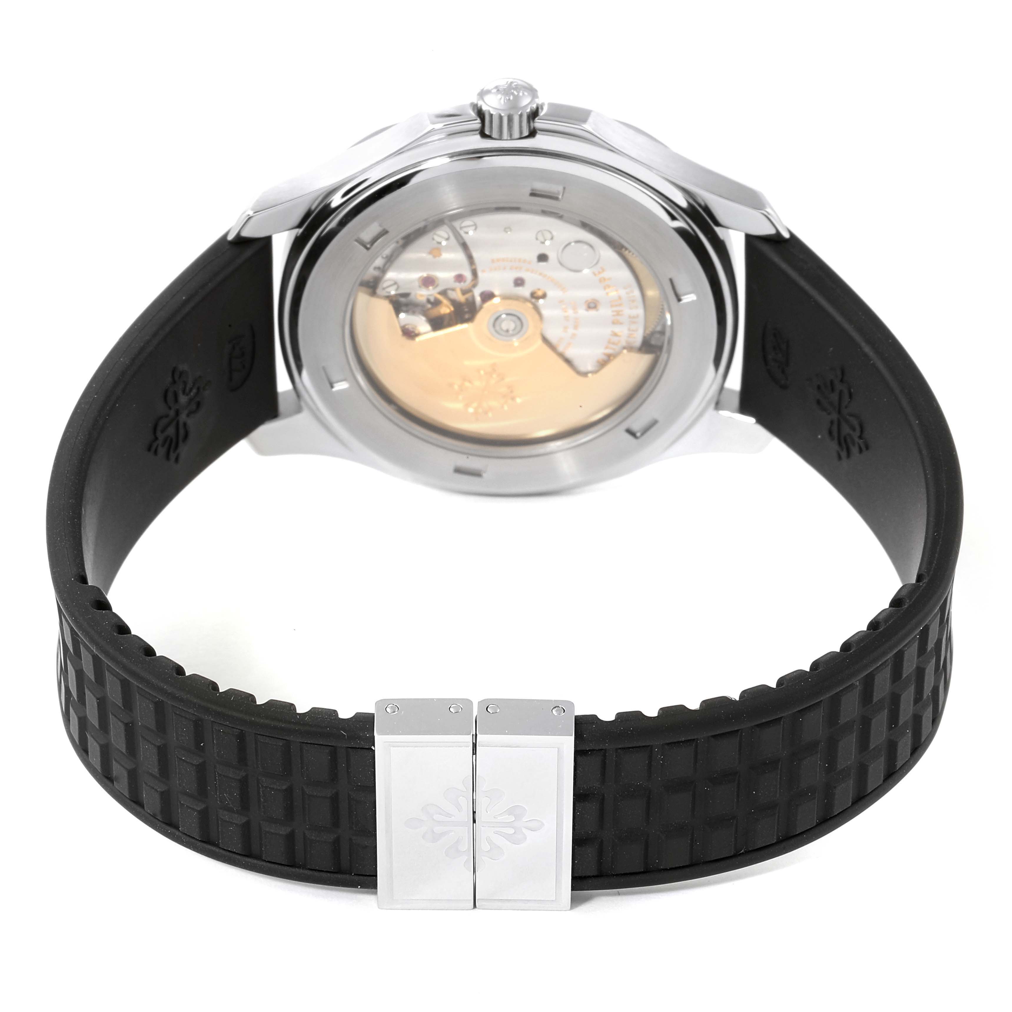 The image shows the back view of a Patek Philippe Aquanaut 5065/1A-010 Men
s Stainless Steel Black Dial 5065/1A-010 Men
s Stainless Steel Black Dial watch, revealing its movement and black rubber strap.