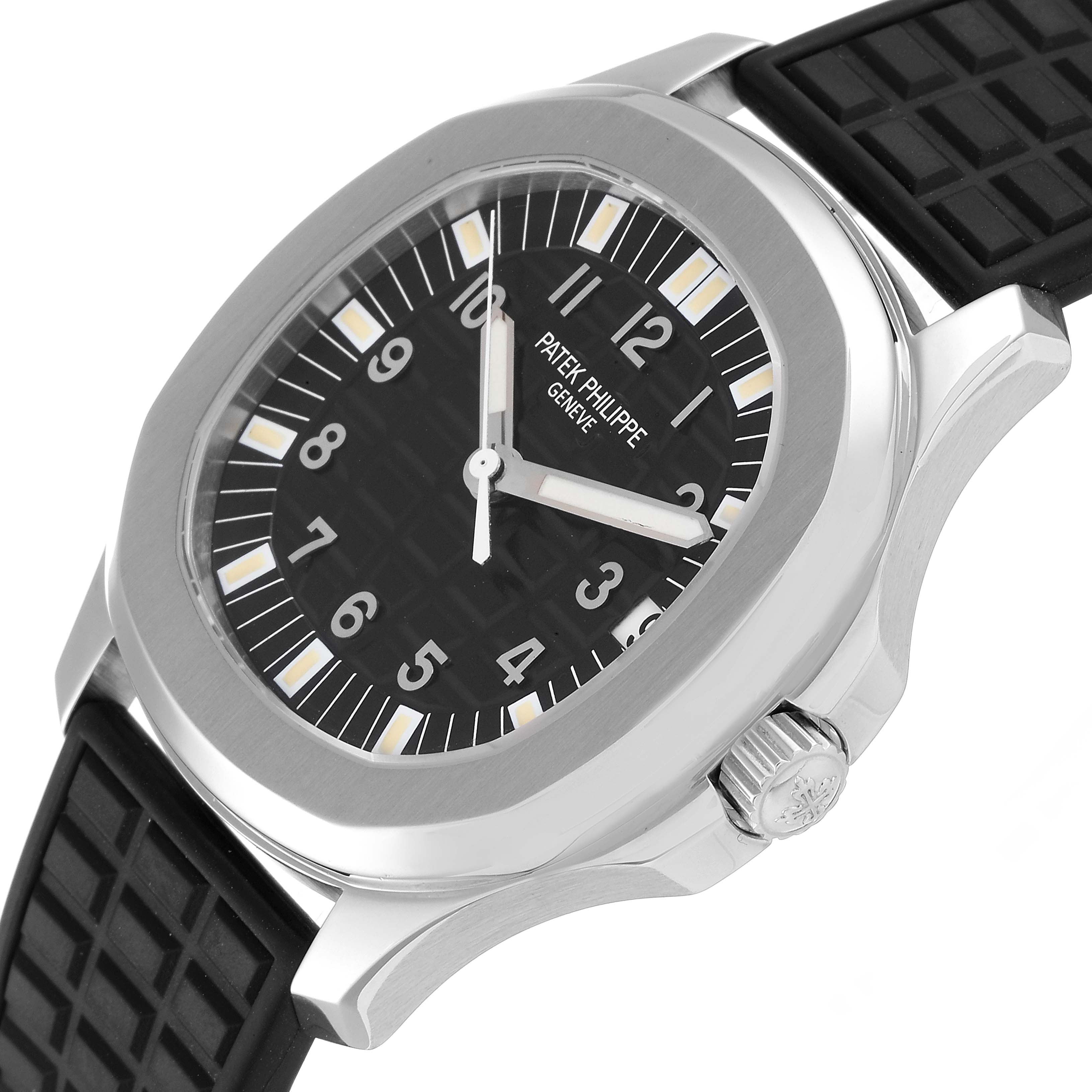The image shows a side-angle view of a Patek Philippe Aquanaut 5065/1A-010 Men
s Stainless Steel Black Dial 5065/1A-010 Men
s Stainless Steel Black Dial watch, highlighting its dial, bezel, and crown.