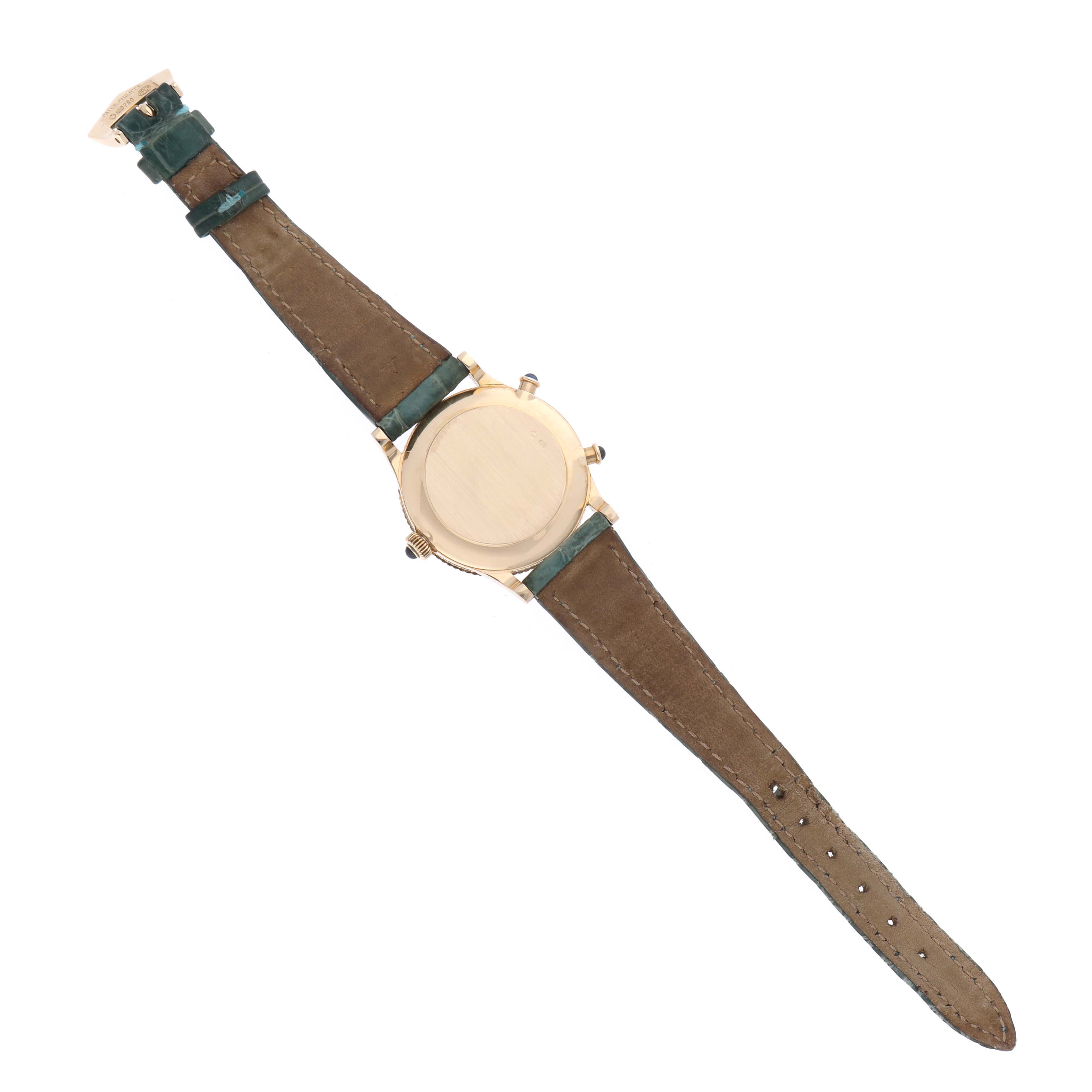 The image shows the back view of a Patek Philippe Calatrava 4864J-001 Women's Yellow Gold White Dial 4864J-001 Women's Yellow Gold White Dial watch with its brown leather strap fully extended.