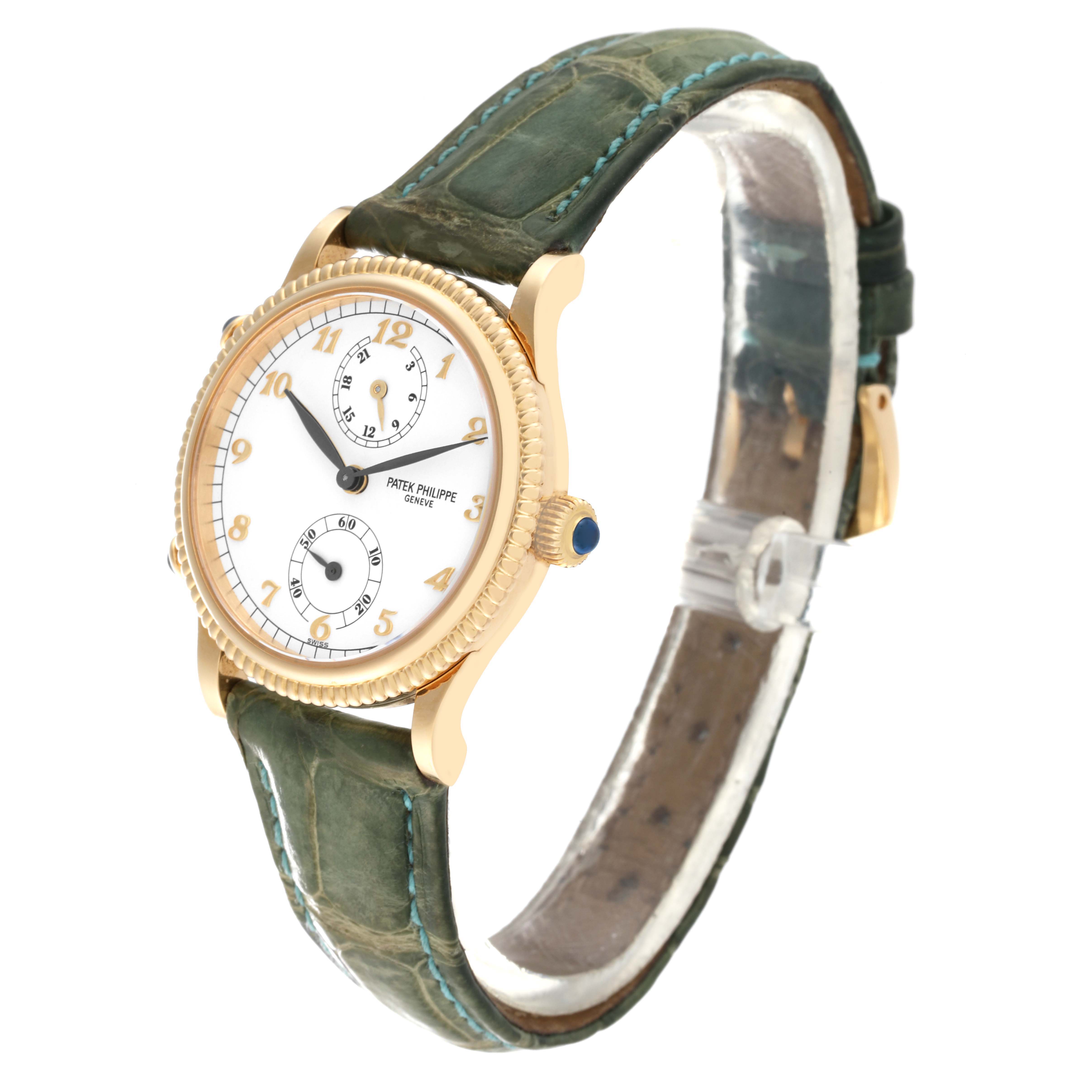 The image shows a Patek Philippe Calatrava 4864J-001 Women's Yellow Gold White Dial 4864J-001 Women's Yellow Gold White Dial watch from an angled side view, including its face, bezel, crown, and strap.