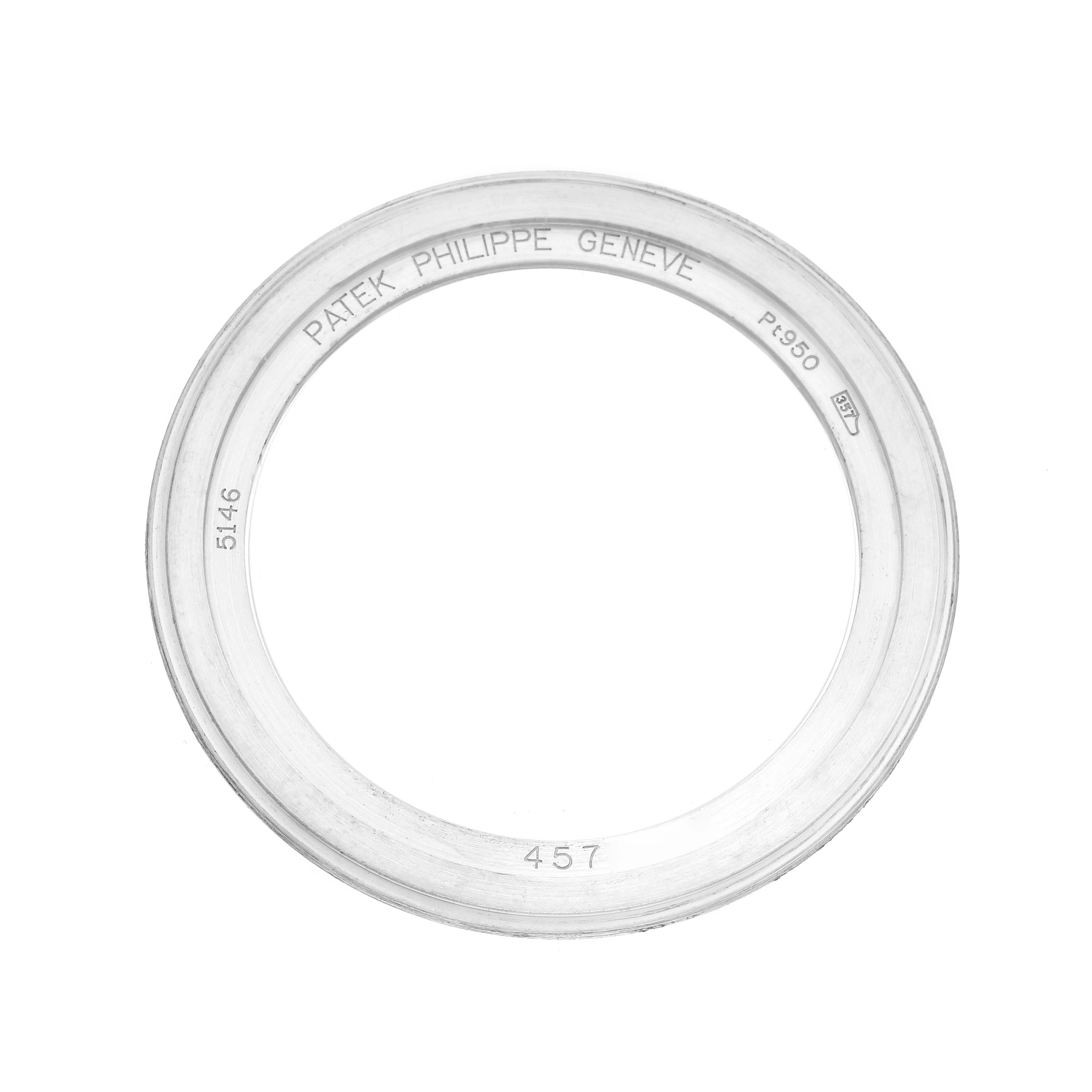 The image shows a Patek Philippe Complications 5146P-001 Men's White Gold Grey Dial bezel, seen from a top-down angle with inscriptions visible on the inner surface.