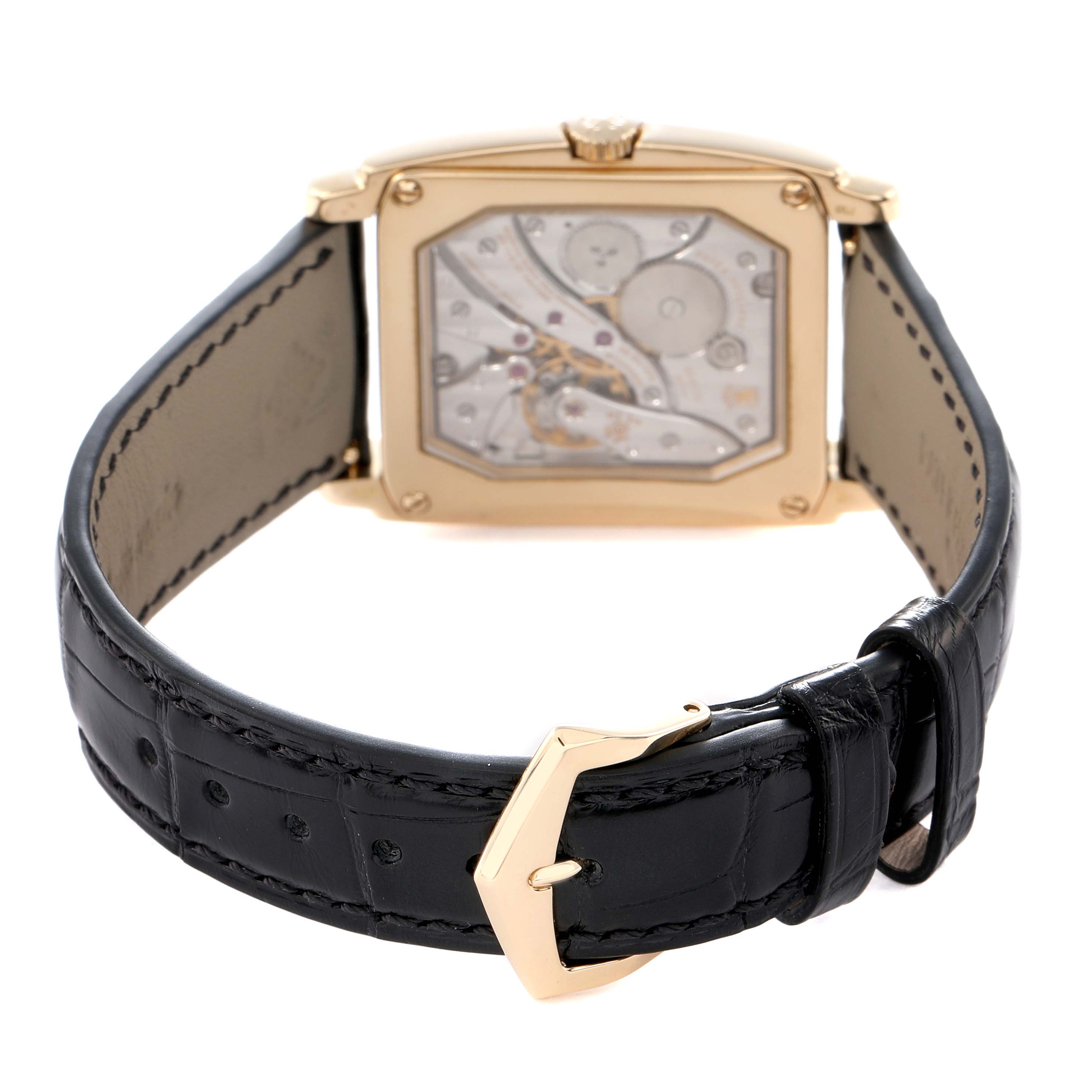 The Patek Philippe Gondolo 5124J 5124J Men
s Yellow Gold Silver Dial watch is shown from the back, displaying the movement and a black leather strap with a gold buckle.