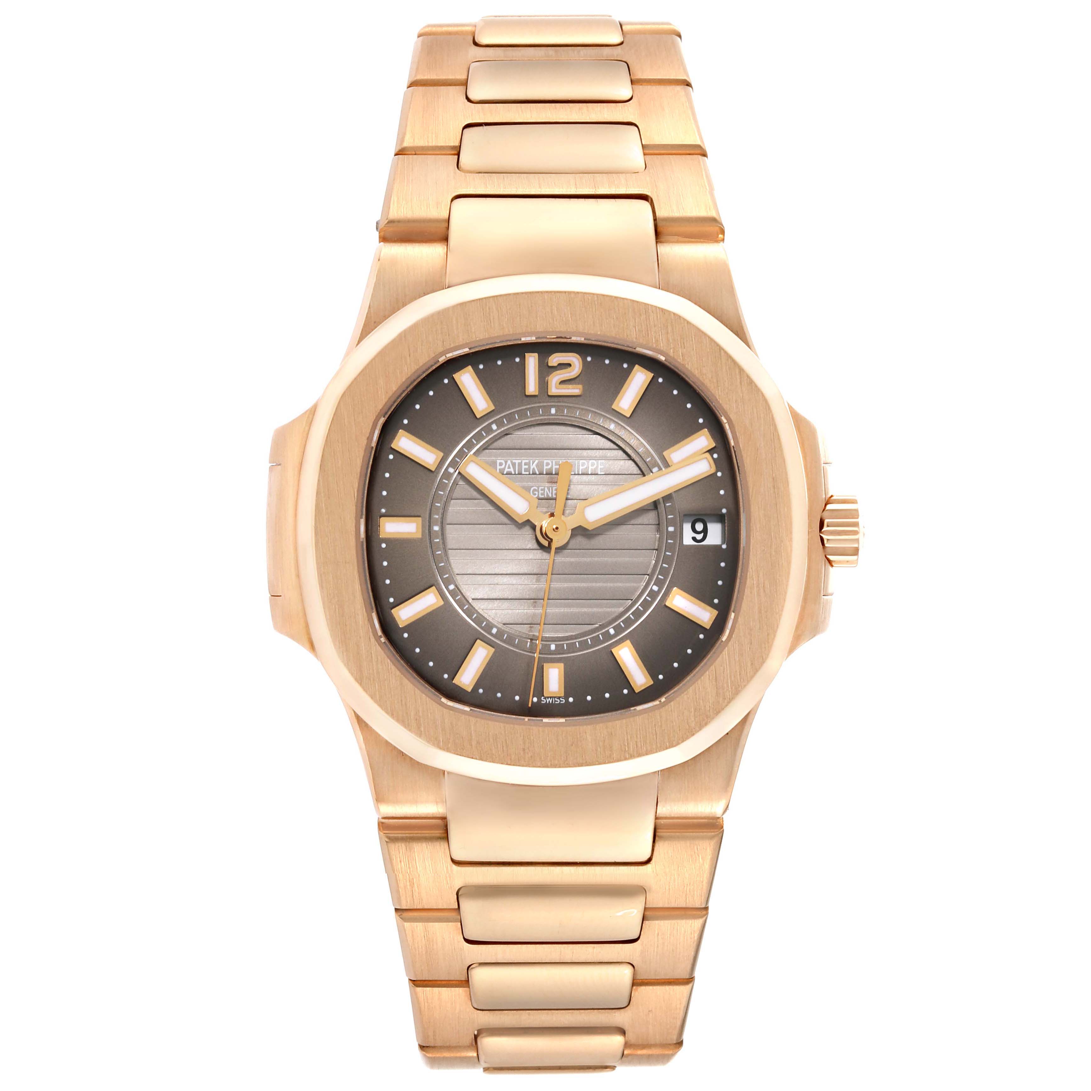 This Patek Philippe Nautilus 7011/1R Women's Rose Gold Grey Dial 7011/1R Women's Rose Gold Grey Dial watch is shown from a front angle, displaying its face, dial, and bracelet.