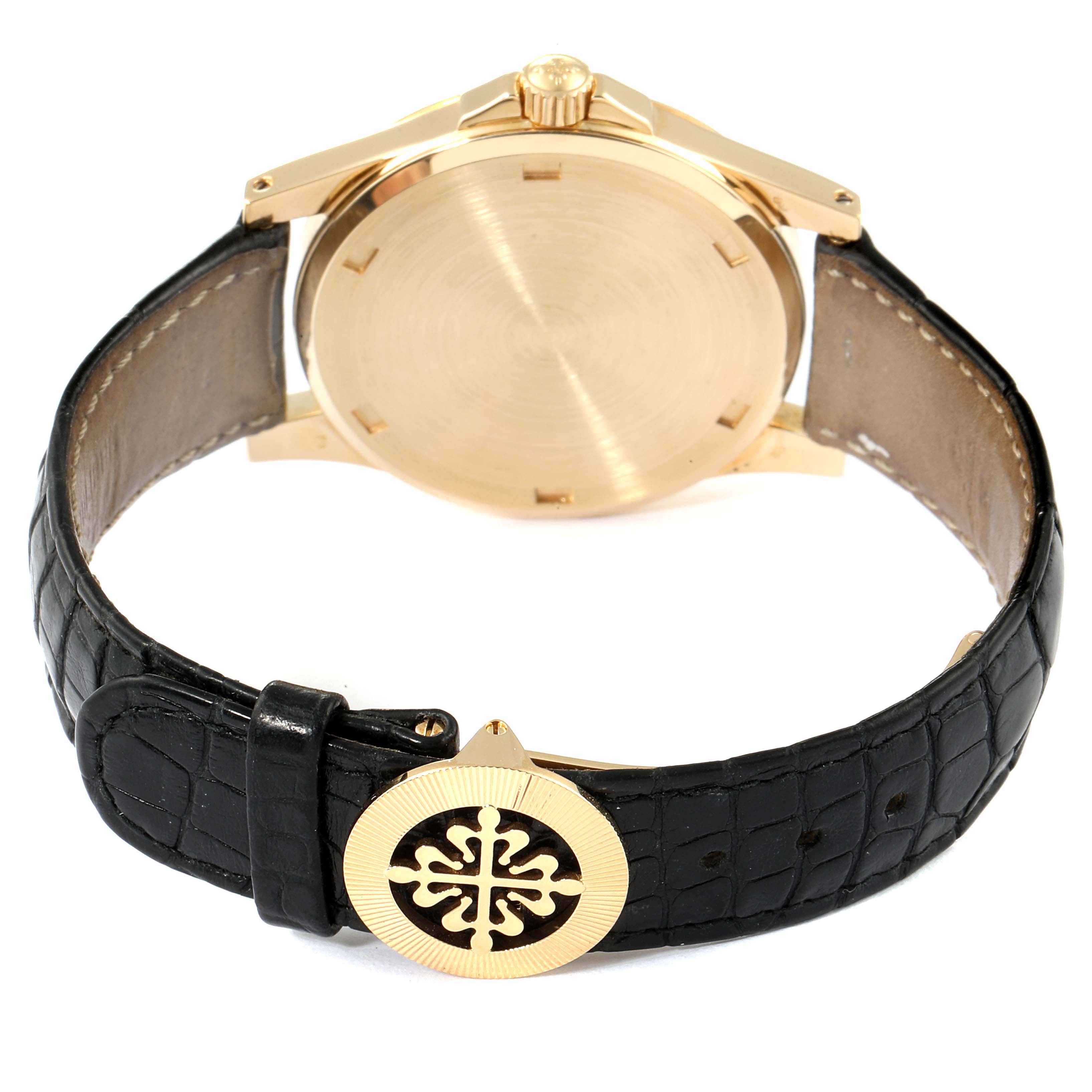 The image shows the back case and band clasp of the Patek Philippe Neptune 5081 Men's Yellow Gold Black Dial 5081 Men's Yellow Gold Black Dial model watch.