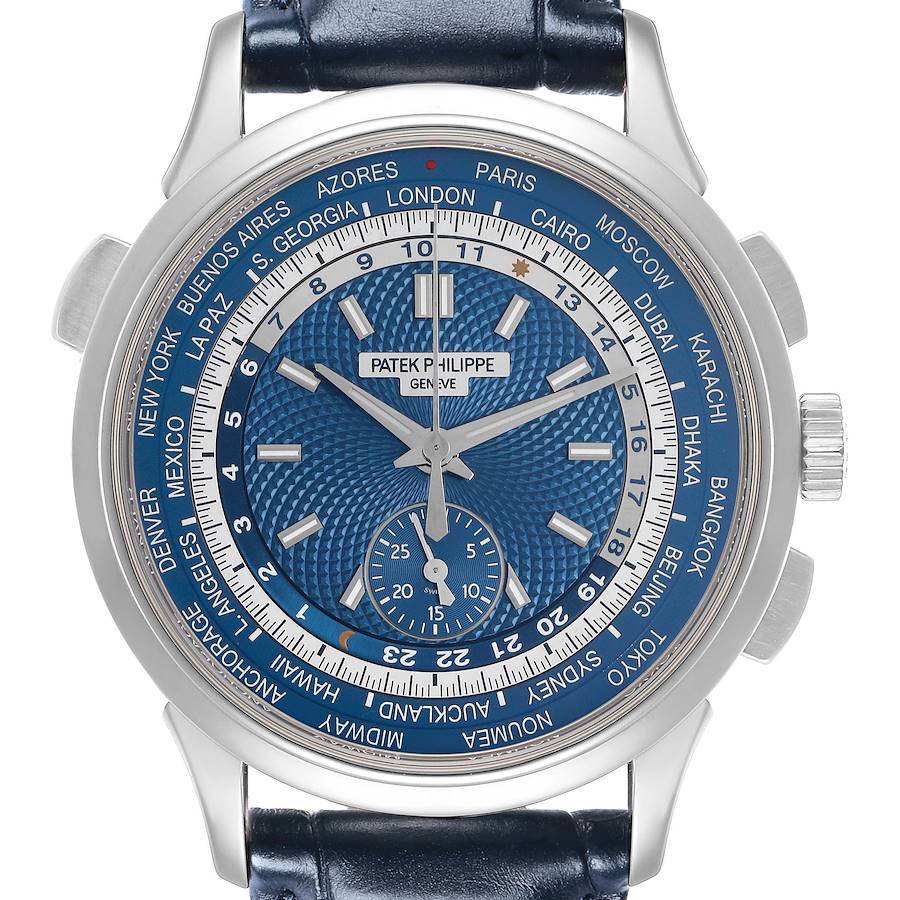 The image shows a front view of the Patek Philippe Complications Men's watch, model 5930G-001, featuring a blue dial with world time cities around the bezel.