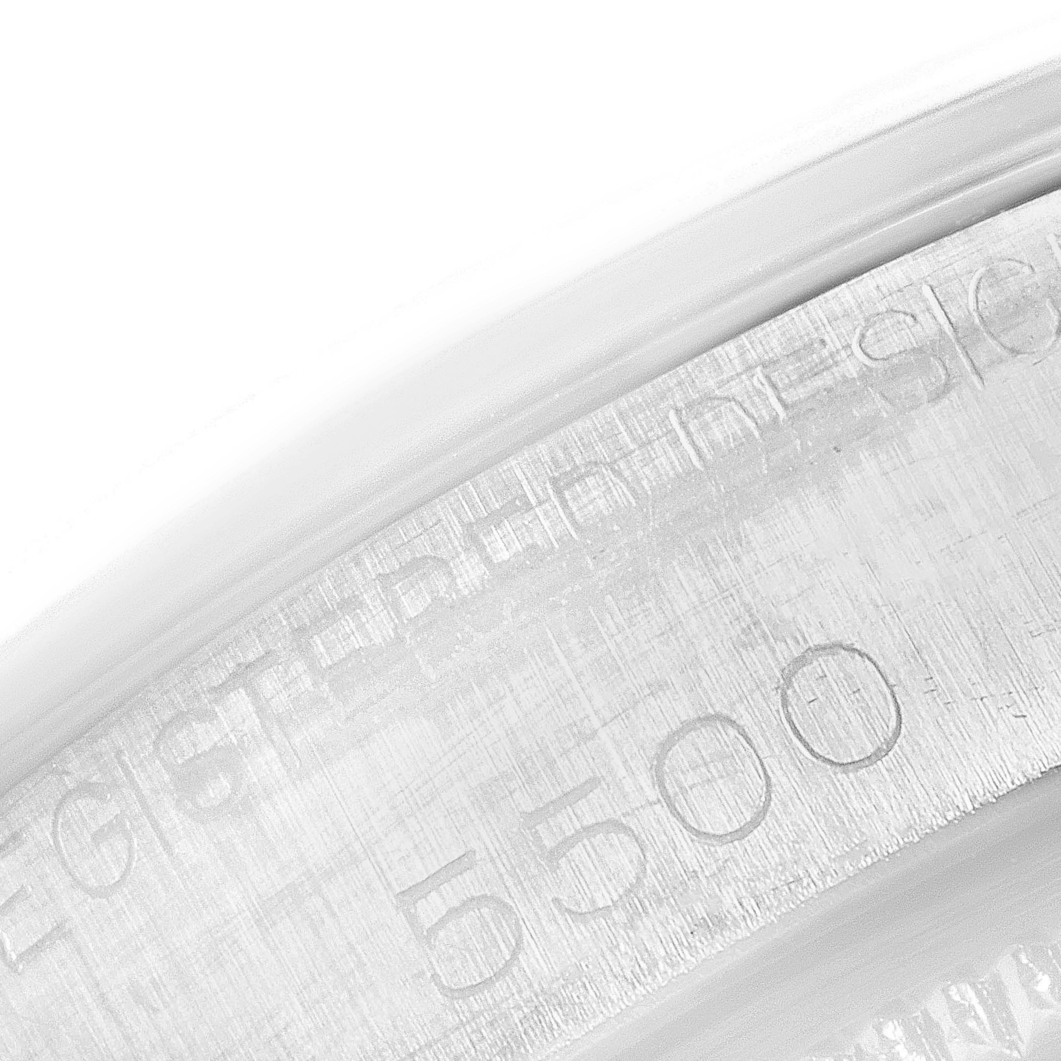 The image shows a close-up view of the engraved serial number "5500" on the case of a Vintage Collection Rolex watch.