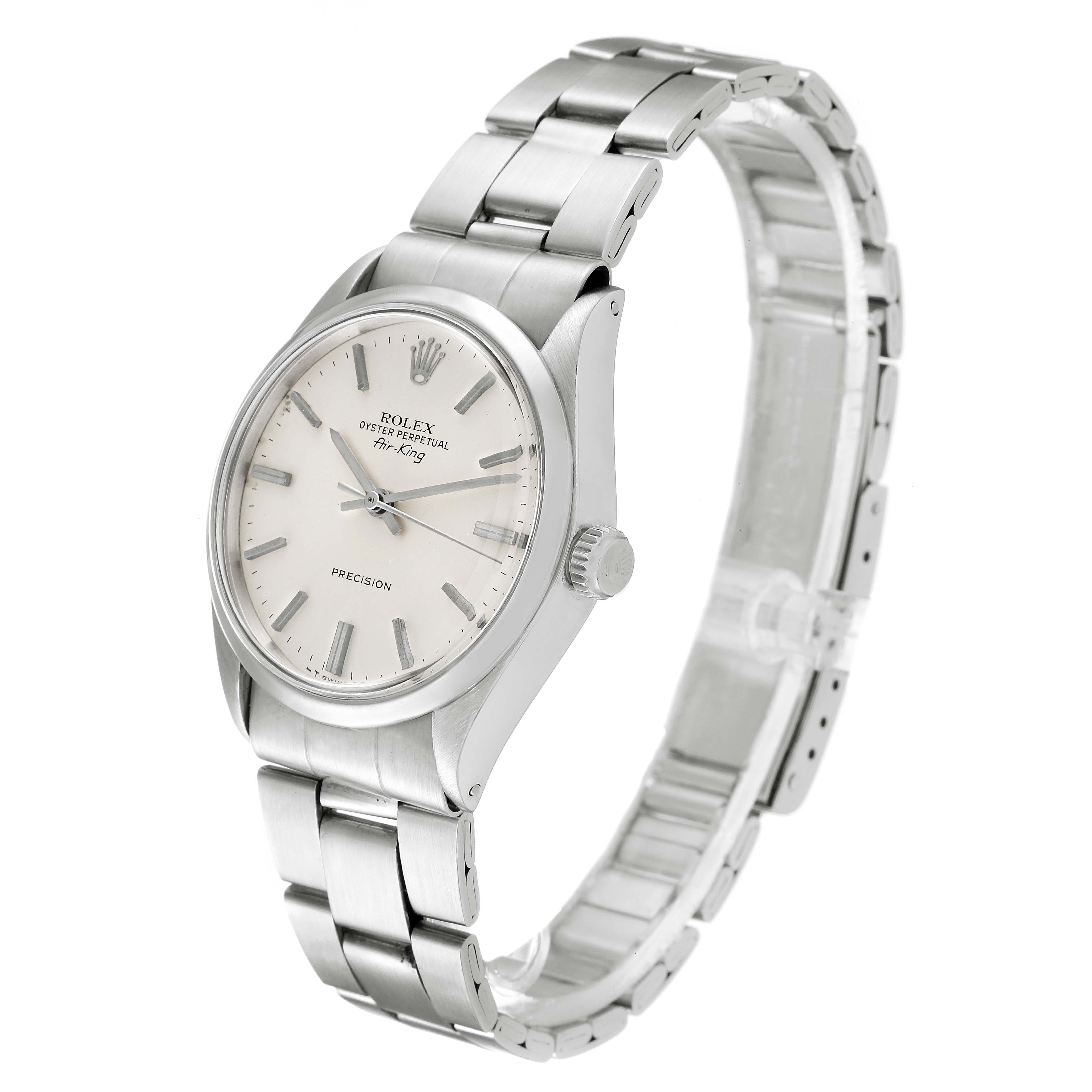 The image shows a side angle of a Vintage Collection Rolex watch, highlighting the face, bezel, crown, and metal bracelet.