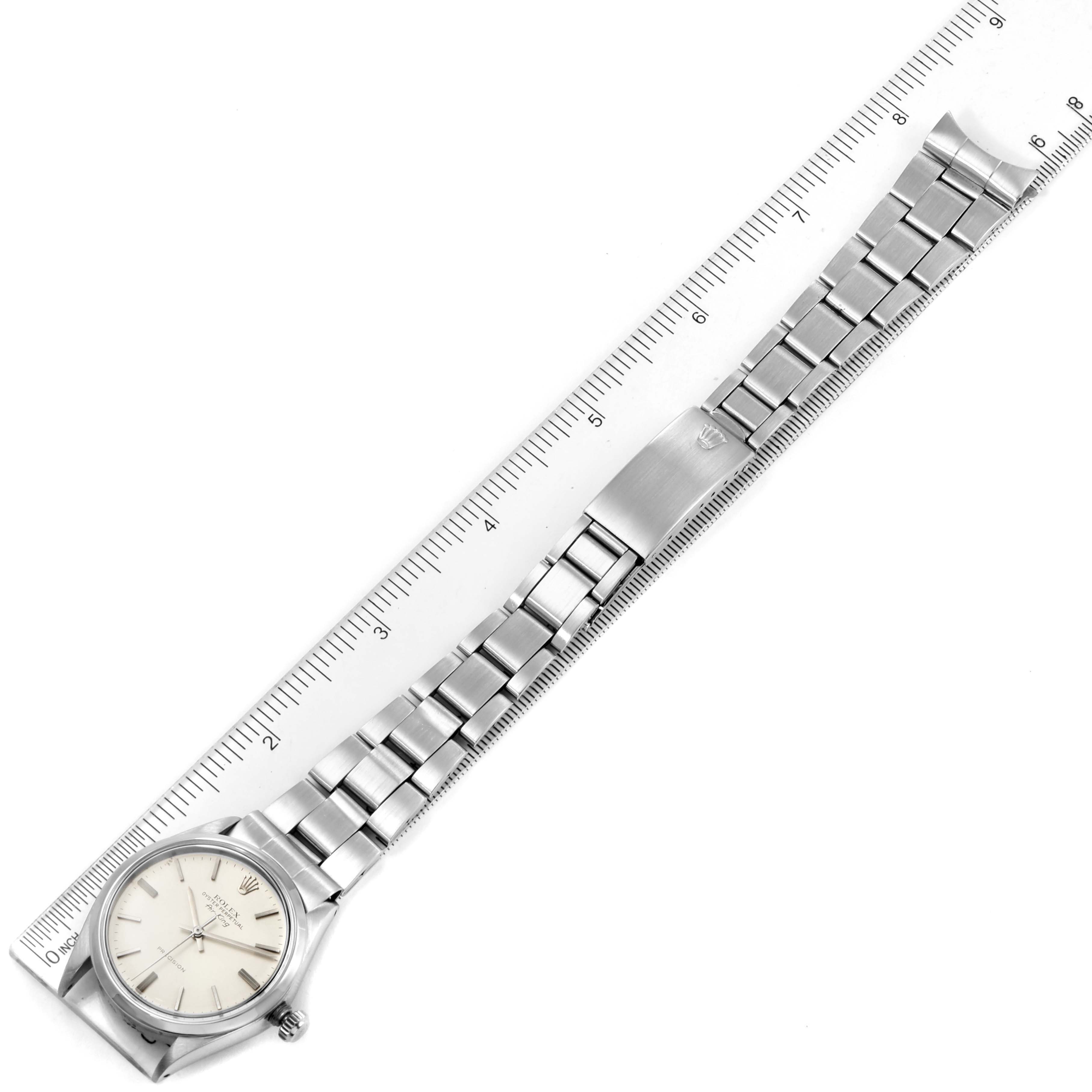 The Rolex Vintage Collection 5500 Men
s Stainless Steel Silver Dial 5500 Men
s Stainless Steel Silver Dial watch is shown flat, featuring the face, bracelet, and clasp, alongside a ruler for scale.