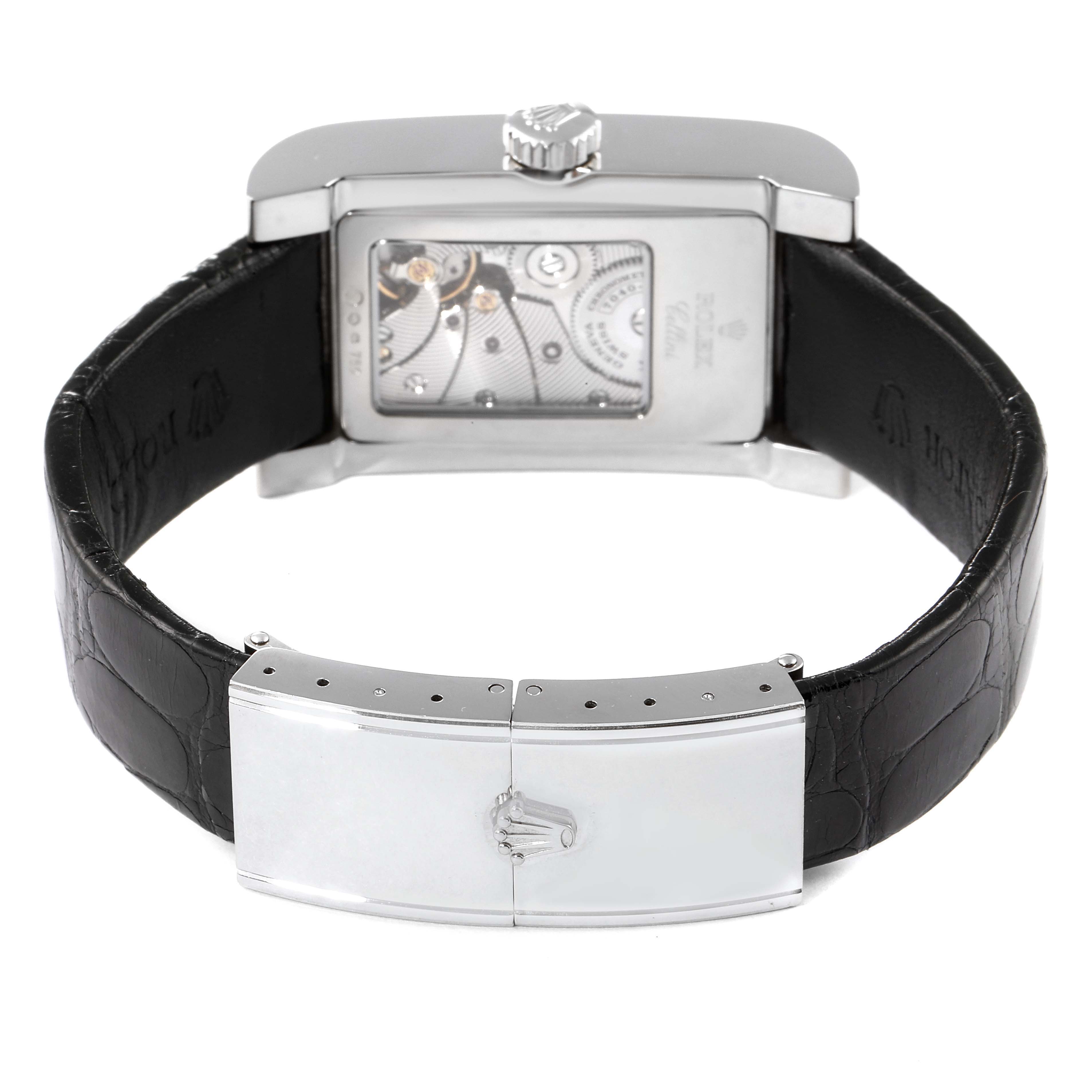 The Rolex Cellini 5441 Men
s White Gold Silver Dial 5441 Men
s White Gold Silver Dial watch is shown from the back, displaying its movement and black leather strap with a clasp.