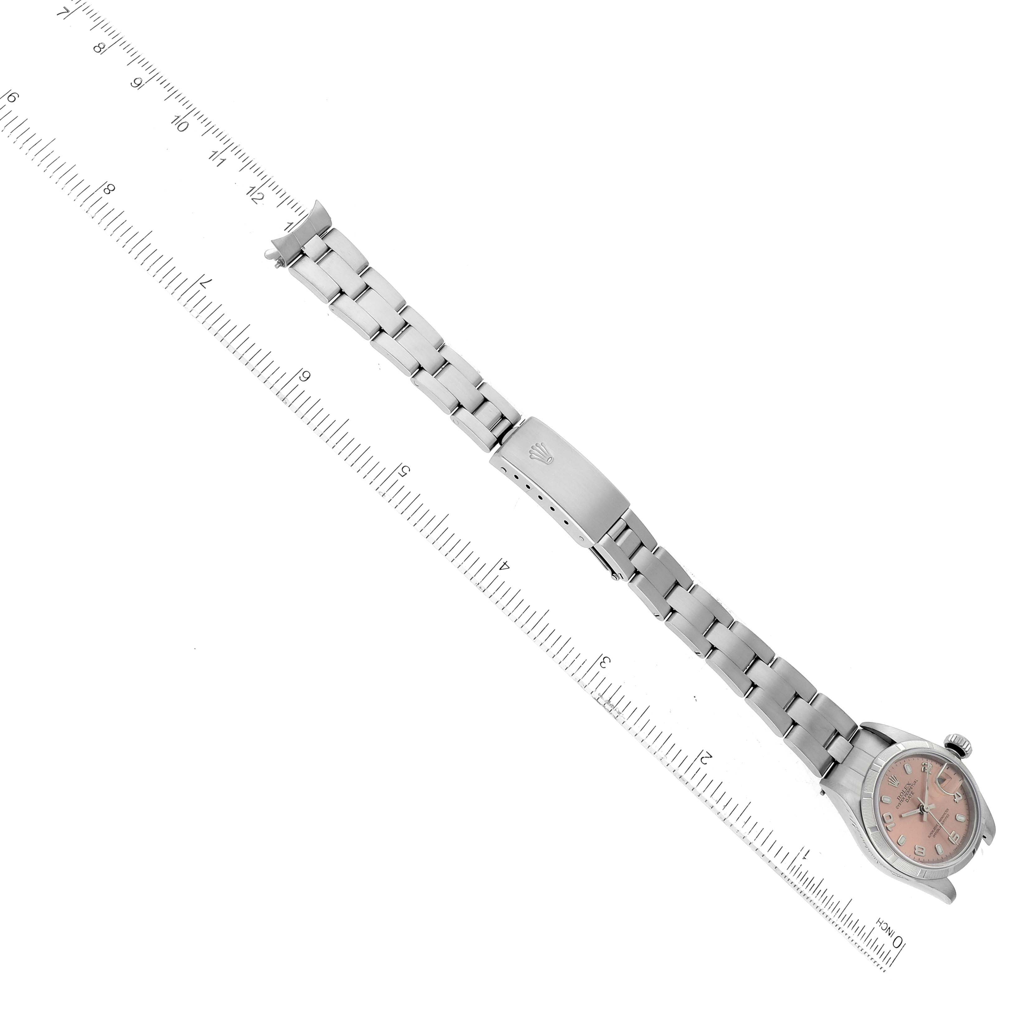 The image shows a Rolex Date 79190 Women's Stainless Steel Pink Dial 79190 Women's Stainless Steel Pink Dial model watch laid out flat, displaying the full length of the metal bracelet and the watch face at an angle.