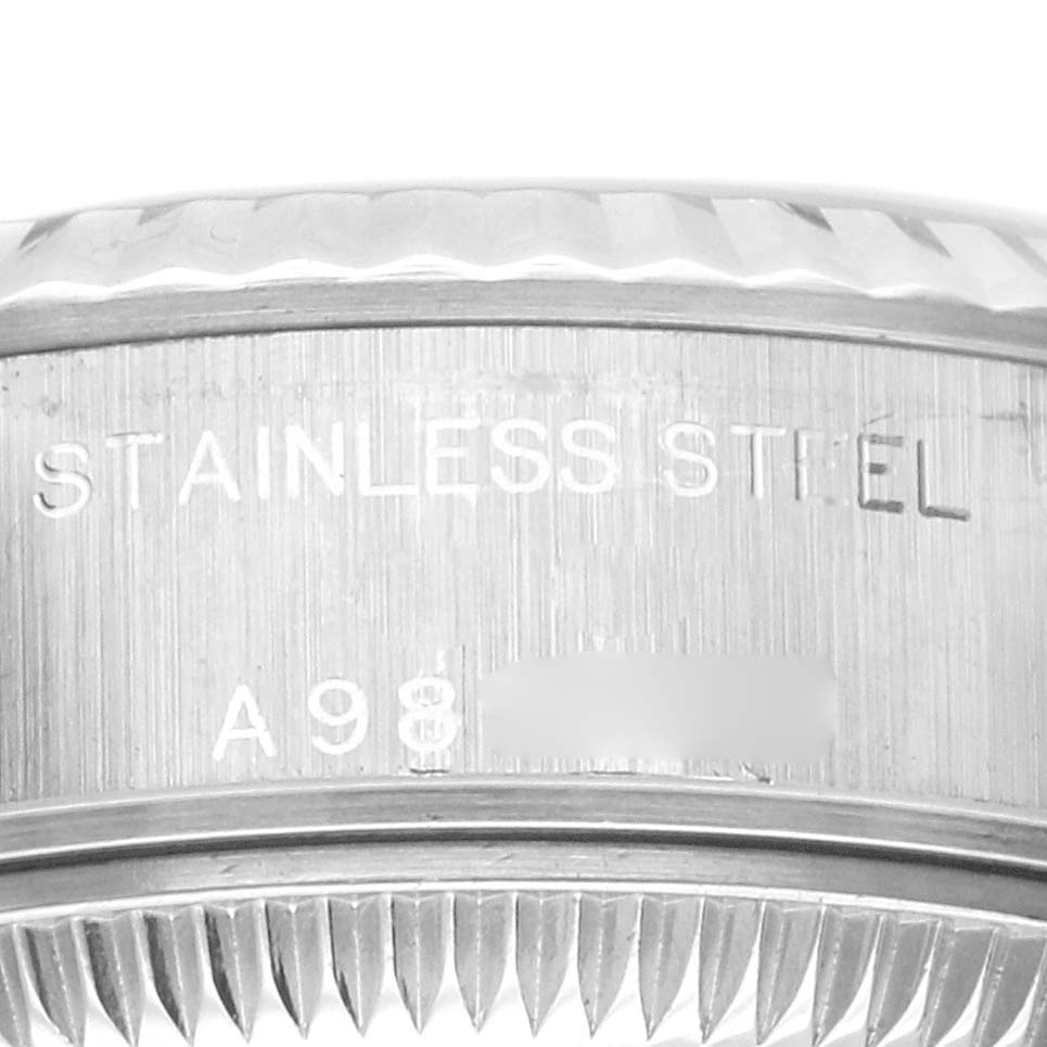 This image shows a close-up of the stainless steel part of a Rolex Datejust 79174 Women's Stainless Steel Silver Dial 79174 Women's Stainless Steel Silver Dial watch, focusing on the engraved text.
