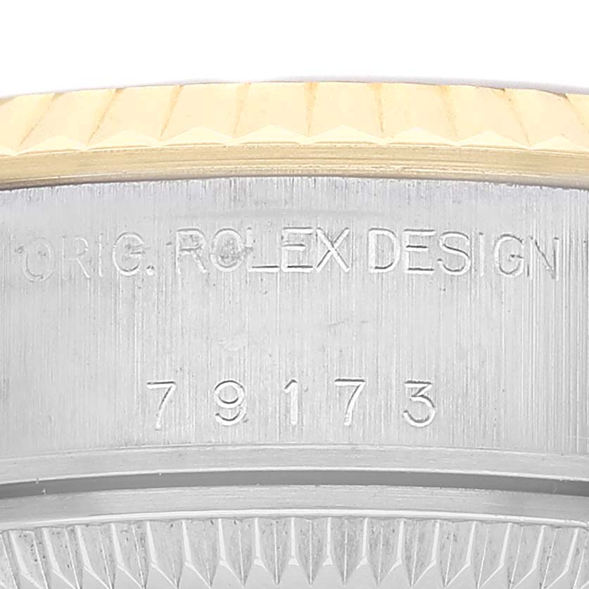 The image shows a close-up of the side of a Rolex Datejust 79173 Women's Stainless Steel White Dial, highlighting the model number and design engravings.