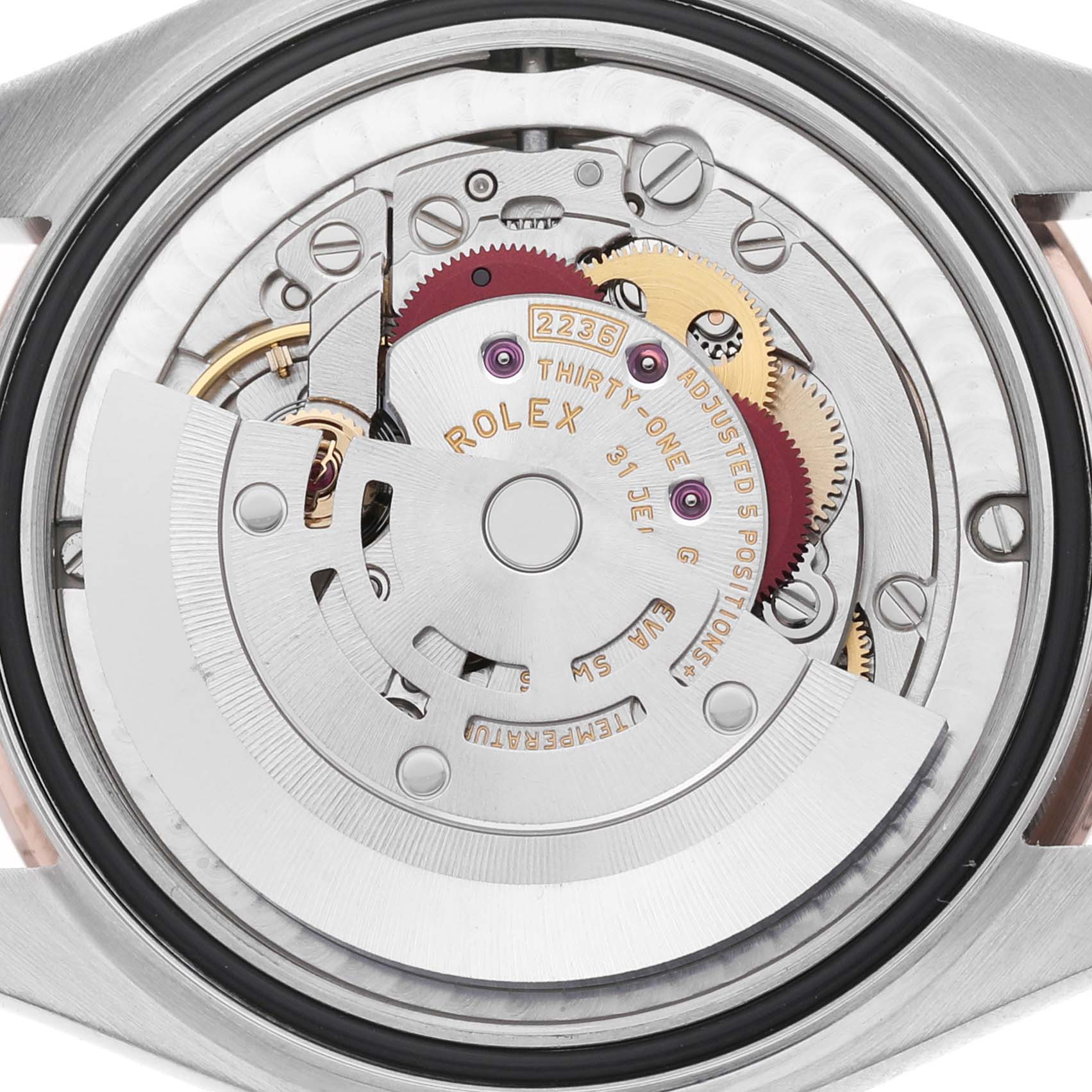 The image shows the back view of a Rolex Mid-Size 278271 Women's Steel and Gold (two tone) Pink Dial watch, highlighting its intricate internal movement mechanism.