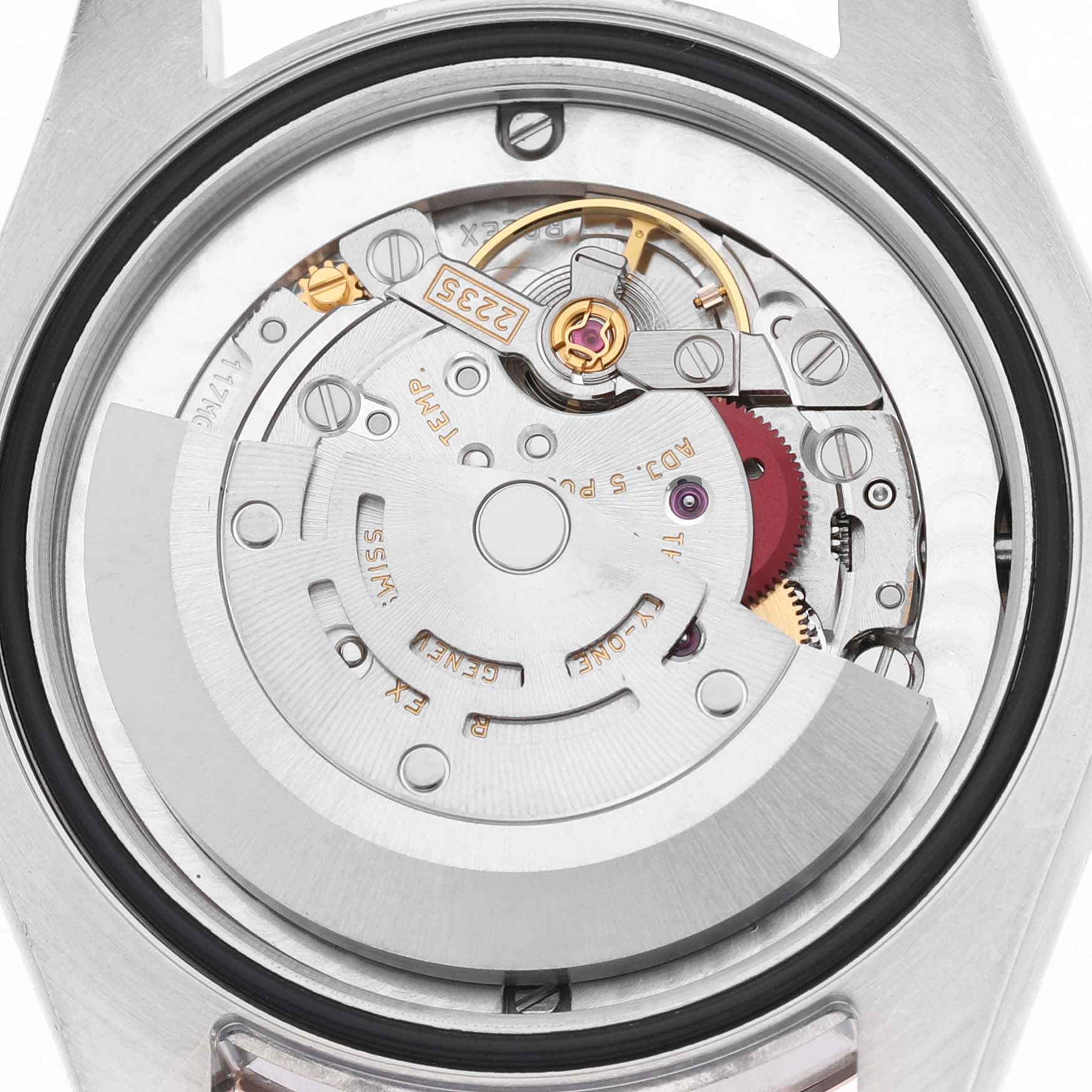 The image shows the internal movement of a Rolex Mid-Size 178271 Women's Steel and Gold (two tone) White Dial watch from a back view, highlighting the intricate gears and rotor.