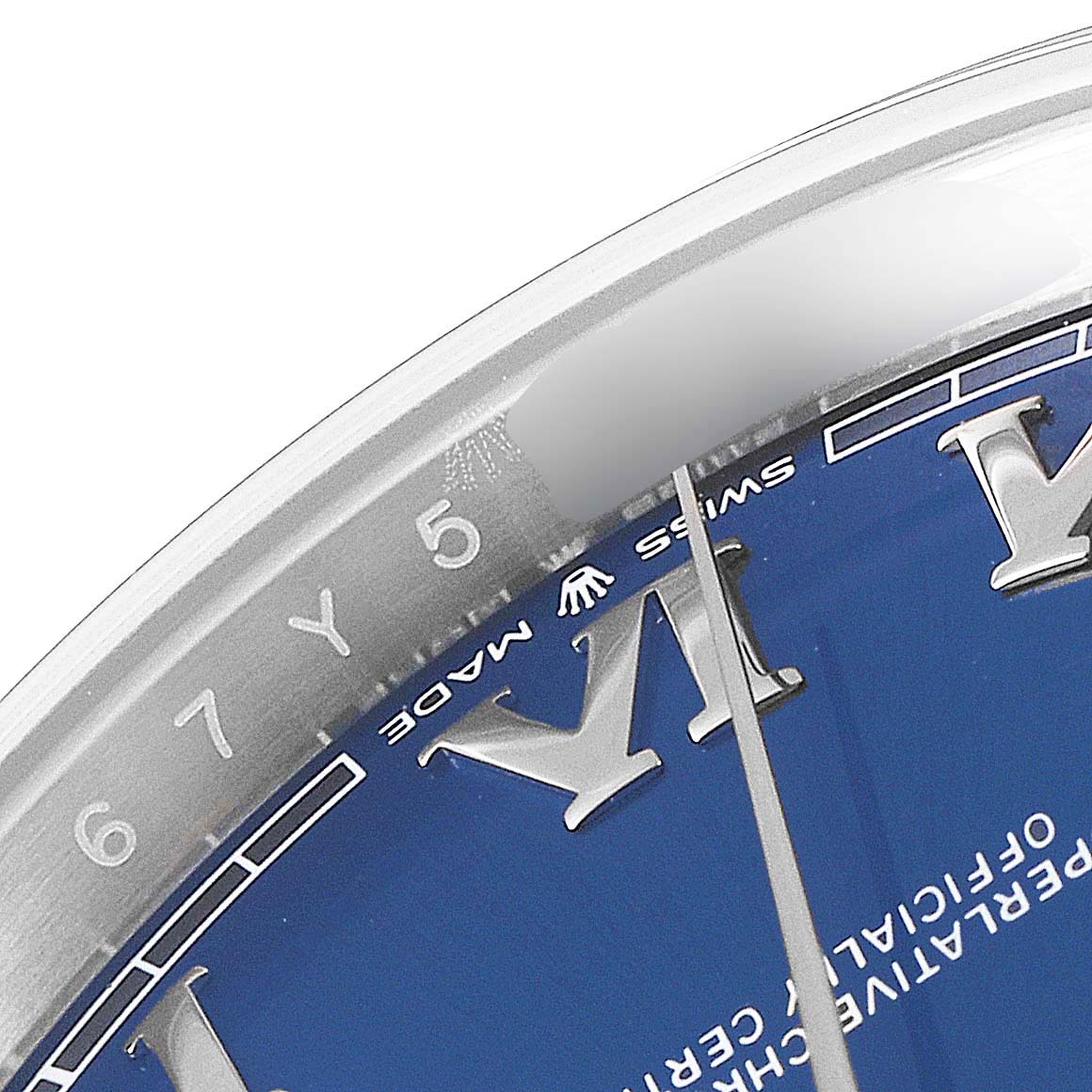 The image shows a close-up of the dial and the bezel of a Rolex Datejust 41 126300 Men
s Stainless Steel Blue Dial 126300 Men
s Stainless Steel Blue Dial watch, focusing on the Roman numerals and outer markings.