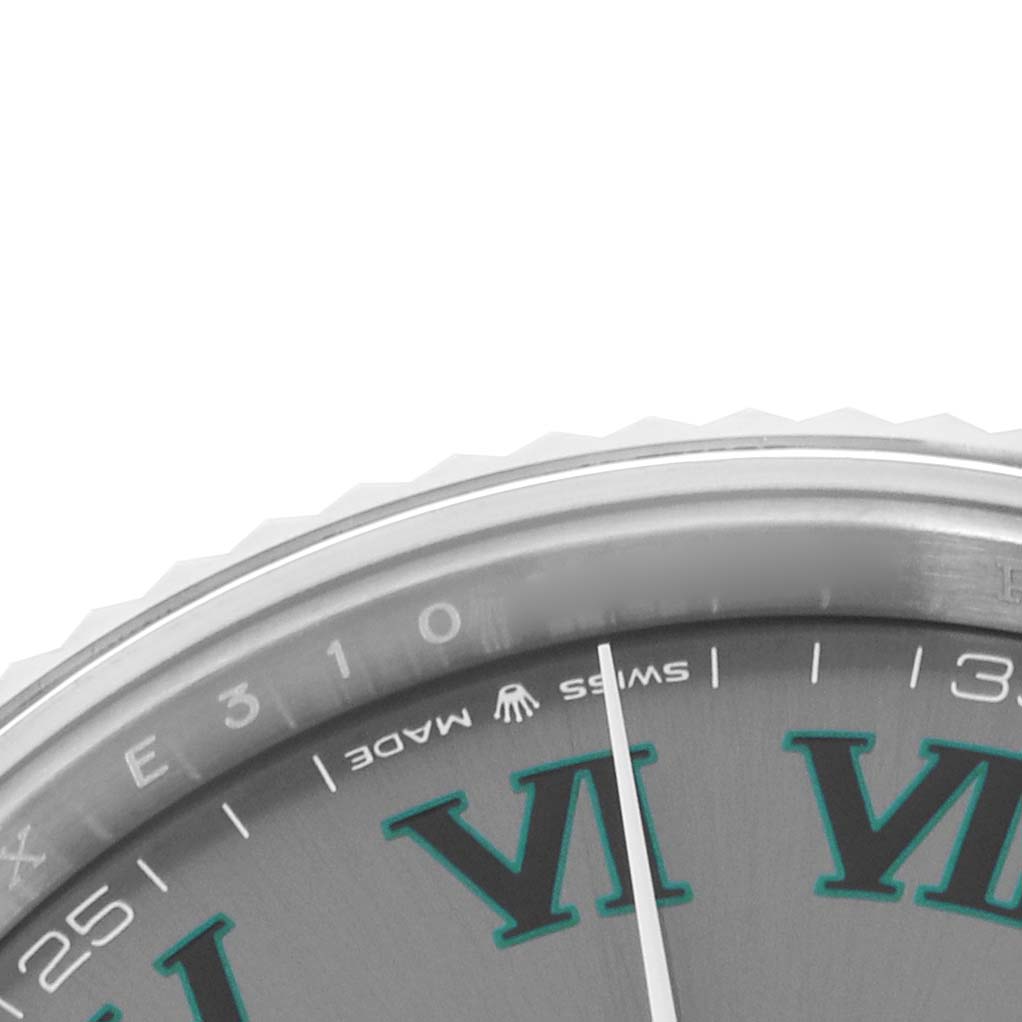 The image shows a close-up of the dial and bezel edge of a Rolex Datejust 41 126334 Men
s Stainless Steel Grey Dial, focusing on the hour markers and details.