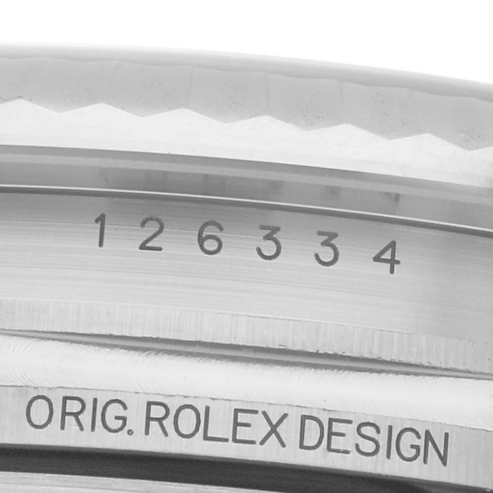 The image shows a close-up of the engraved model number and "ORIG. ROLEX DESIGN" on the side of a Rolex Datejust 41 126334 Men
s Stainless Steel Grey Dial bezel.