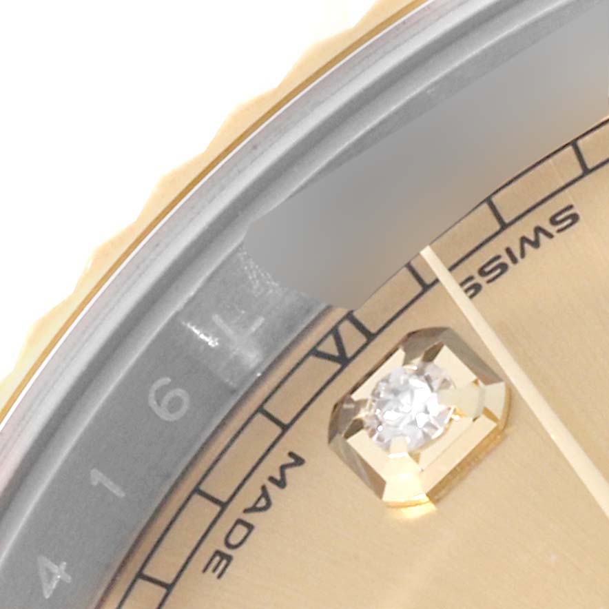 The image shows a close-up of the dial and part of the bezel on a Rolex Datejust 41 126333 Men's Steel and Gold (two tone) Champagne Dial 126333 Men's Steel and Gold (two tone) Champagne Dial watch, highlighting the diamond hour marker.