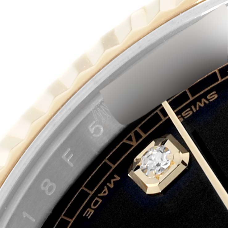The image shows a close-up of the bezel and one of the hour markers with a diamond on the Rolex Datejust 41 126333 Men's Steel and Gold (two tone) Black Dial 126333 Men's Steel and Gold (two tone) Black Dial watch.